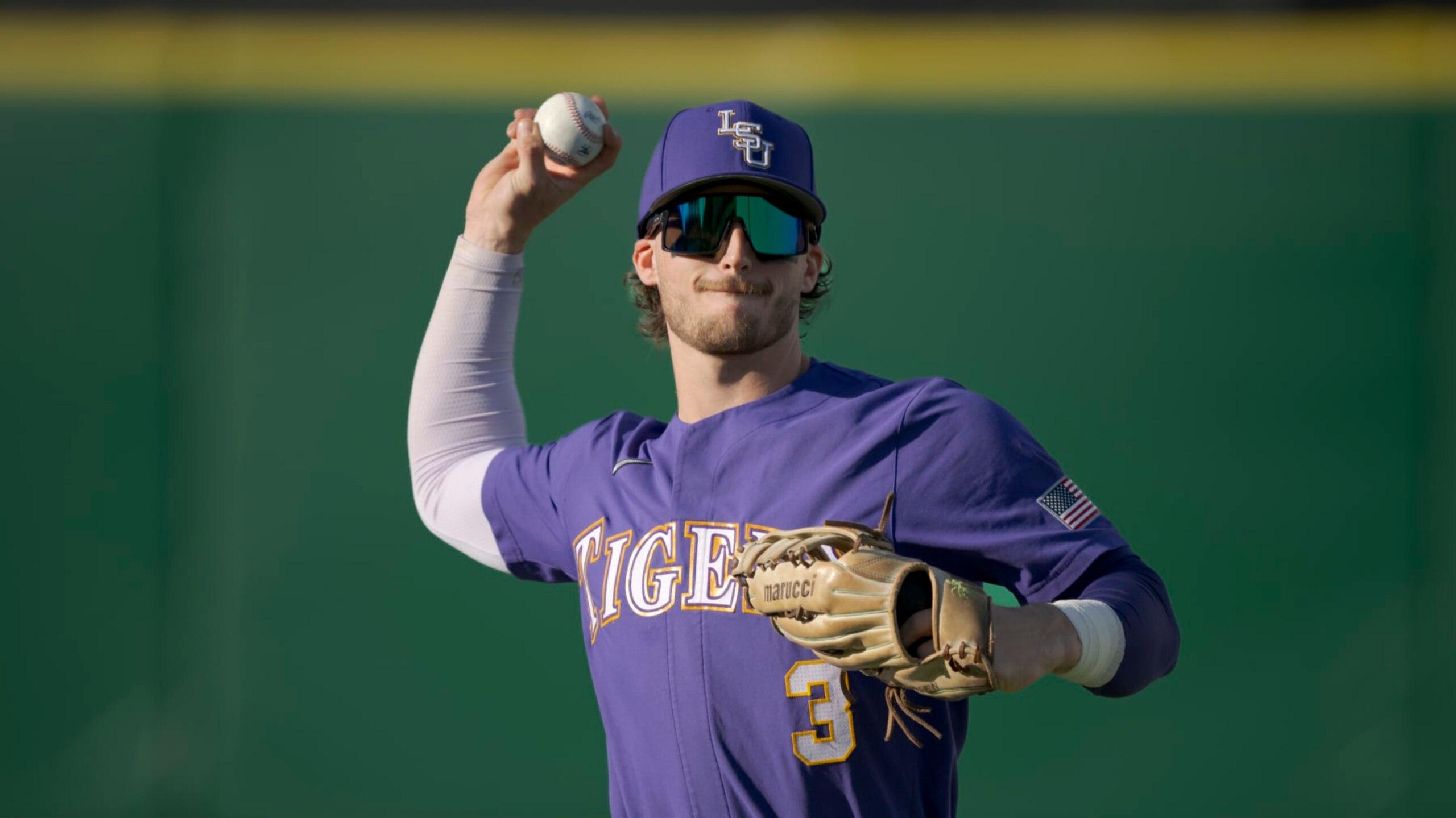 LSU outfielder Dylan Crews (3) throws during an NCAA baseball game on Tuesday, March 21, 2023, in Baton Rouge, La. (AP Photo/Matthew Hinton)