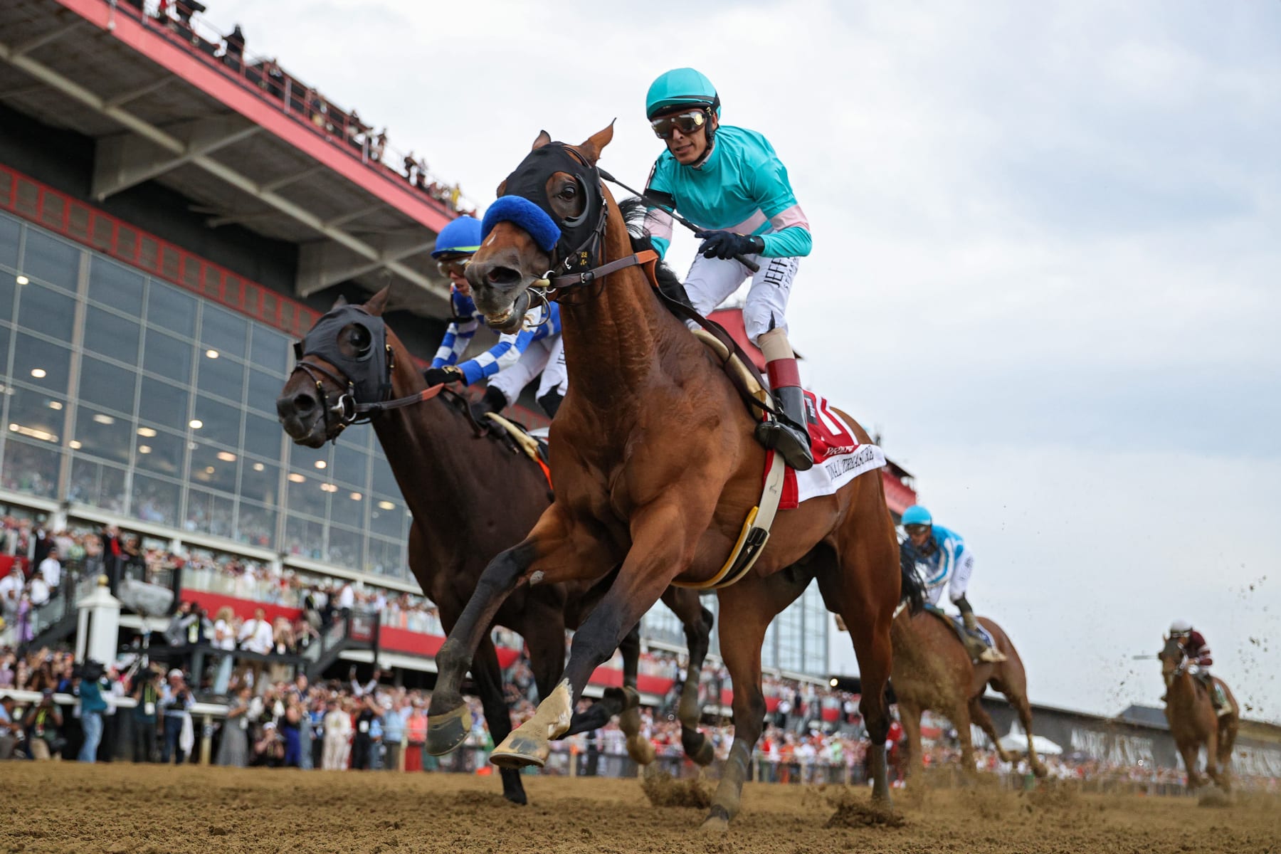 BALTIMORE, MARYLAND - MAY 20: Jockey John Velazquez #1 riding National Treasure (FRONT) rides alongside jockey Irad Ortiz Jr. #7 riding Blazing Sevens to cross the finish line first to win the 148th Running of the Preakness Stakes at Pimlico Race Course on May 20, 2023 in Baltimore, Maryland. (Photo by Patrick Smith/Getty Images)