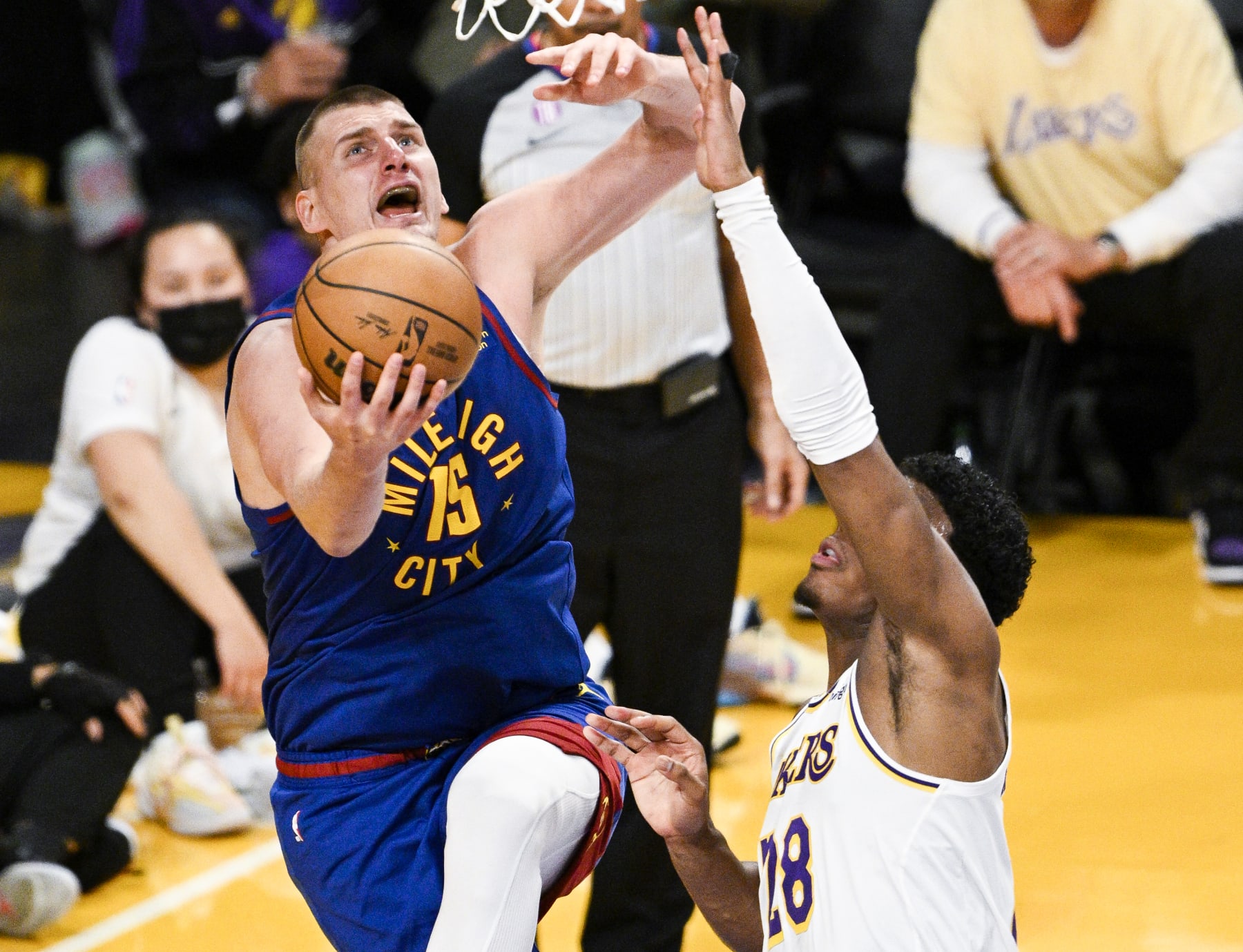 LOS ANGELES, CA - MAY 20: Denver Nuggets center Nikola Jokic, left, goes up for a shot past Los Angeles Lakers forward Rui Hachimura during the third quarter of game three in the NBA Playoffs Western Conference Finals at Crypto.com Arena on Saturday, May 20, 2023 in Los Angeles, CA. (Gina Ferazzi / Los Angeles Times via Getty Images)