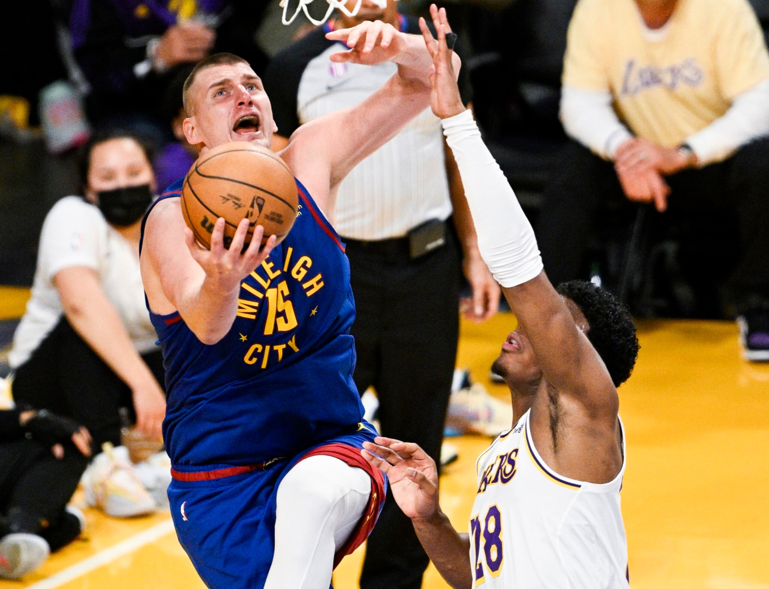 LOS ANGELES, CA - MAY 20: Denver Nuggets center Nikola Jokic, left, goes up for a shot past Los Angeles Lakers forward Rui Hachimura during the third quarter of game three in the NBA Playoffs Western Conference Finals at Crypto.com Arena on Saturday, May 20, 2023 in Los Angeles, CA. (Gina Ferazzi / Los Angeles Times via Getty Images)