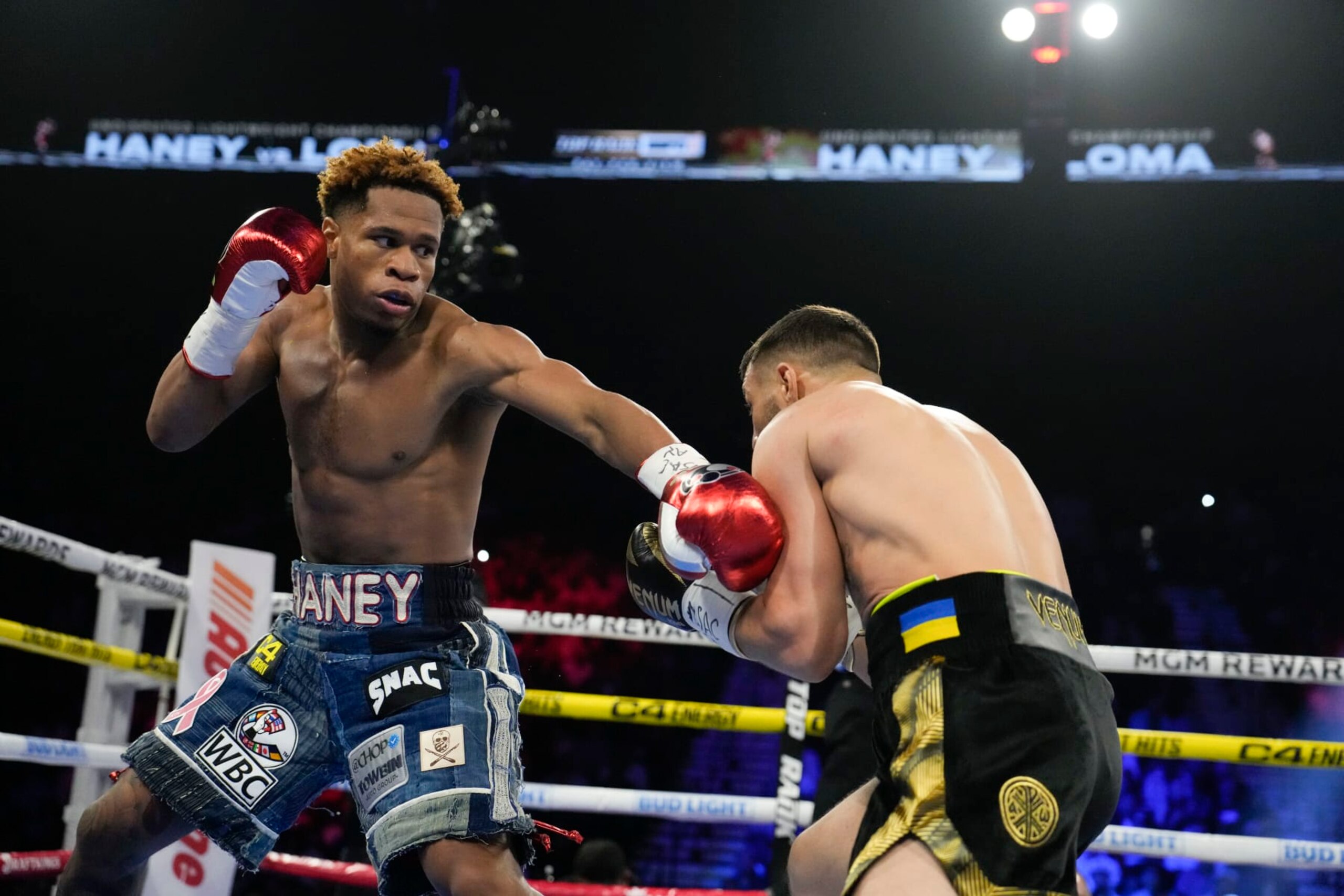 Devin Haney, left, fights Vasiliy Lomachenko in an undisputed lightweight championship boxing match Saturday, May 20, 2023, in Las Vegas. (AP Photo/John Locher)