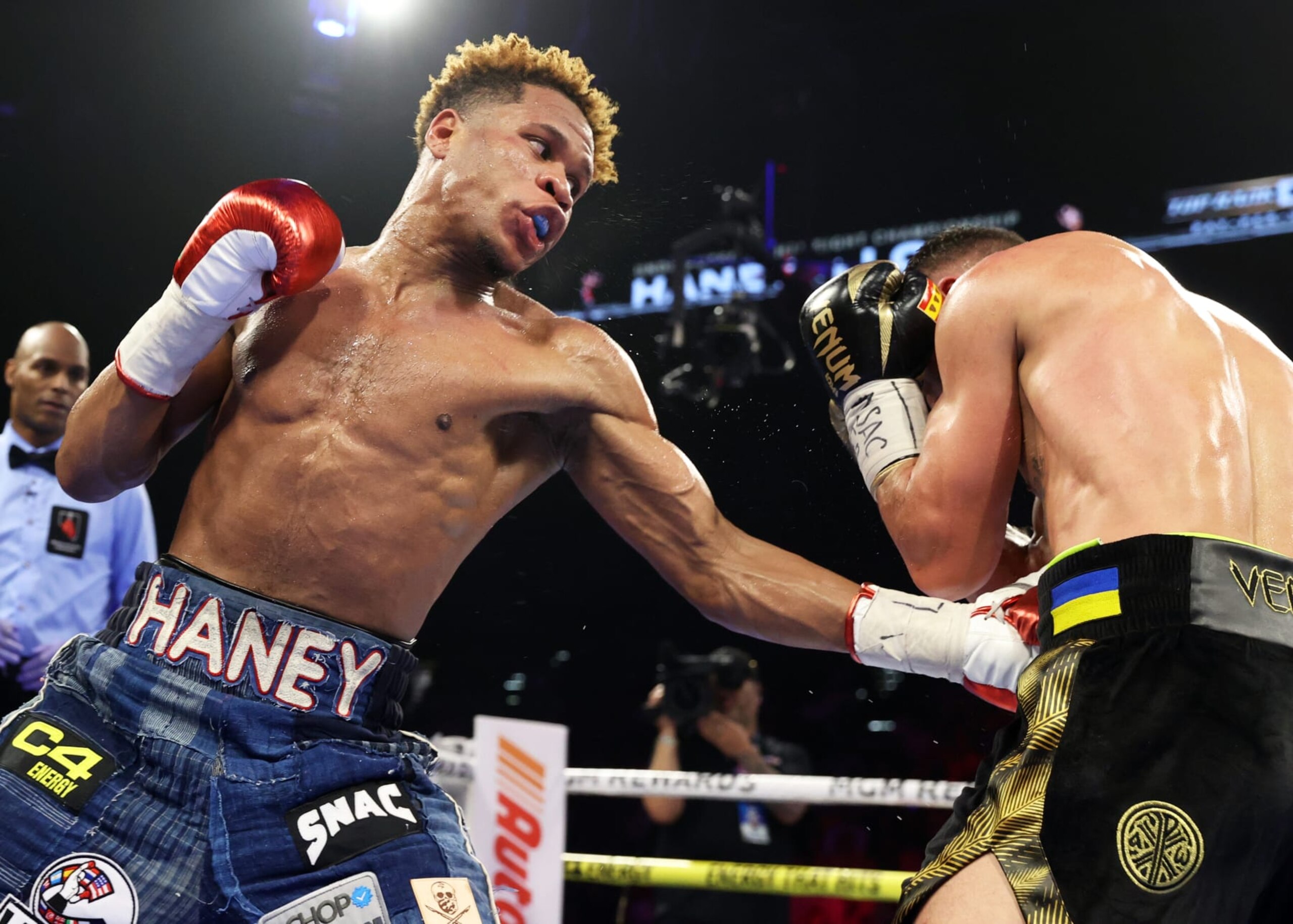 LAS VEGAS, NEVADA - MAY 20: Devin Haney (L) and Vasiliy Lomachenko (R) exchange punches during their Undisputed lightweight championship fight at MGM Grand Hotel & Casino on May 20, 2023 in Las Vegas, Nevada. (Photo by Mikey Williams/Top Rank Inc via Getty Images)