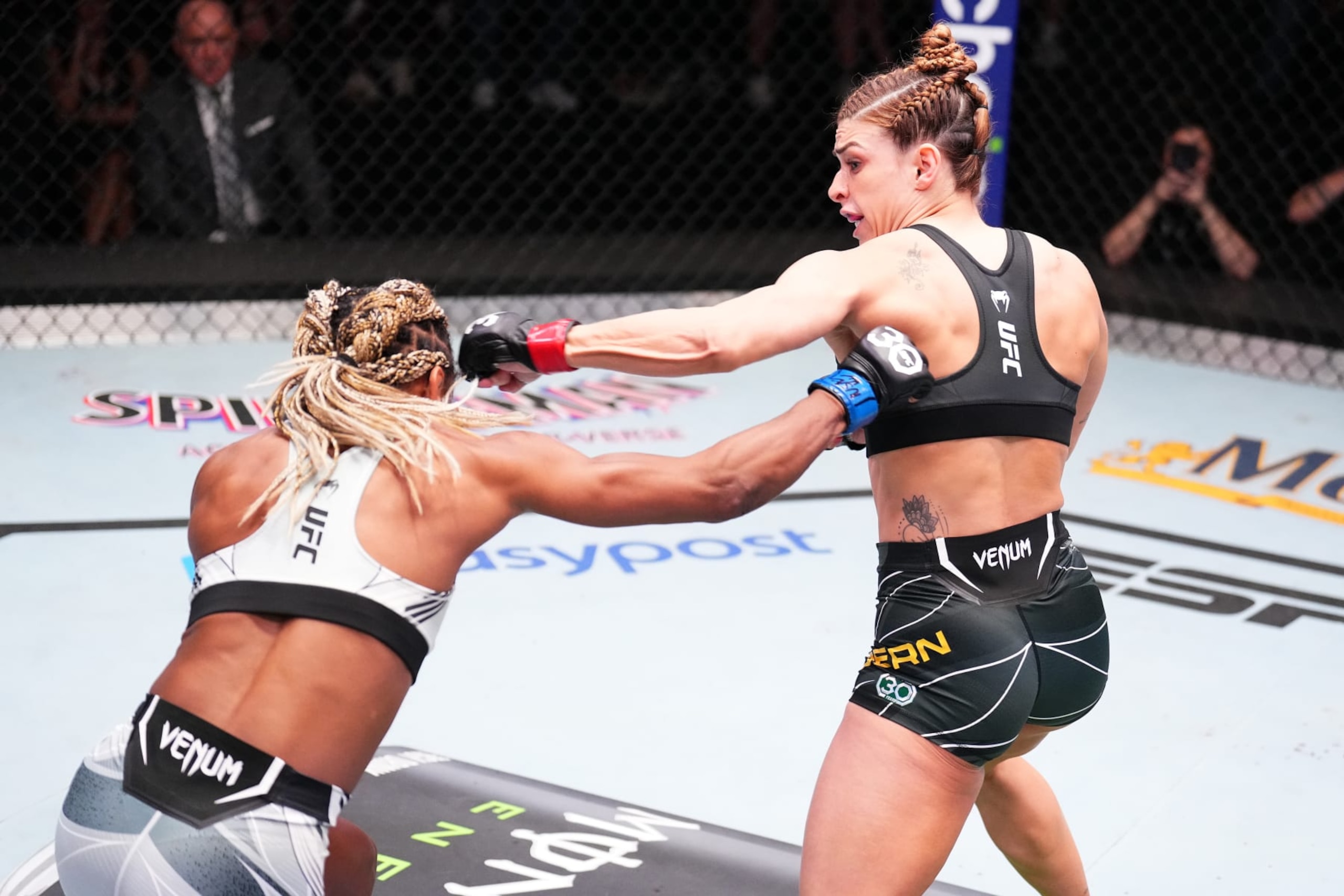 LAS VEGAS, NEVADA - MAY 20: (R-L) Mackenzie Dern punches Angela Hill in a strawweight fight during the UFC Fight Night event at UFC APEX on May 20, 2023 in Las Vegas, Nevada. (Photo by Chris Unger/Zuffa LLC via Getty Images)