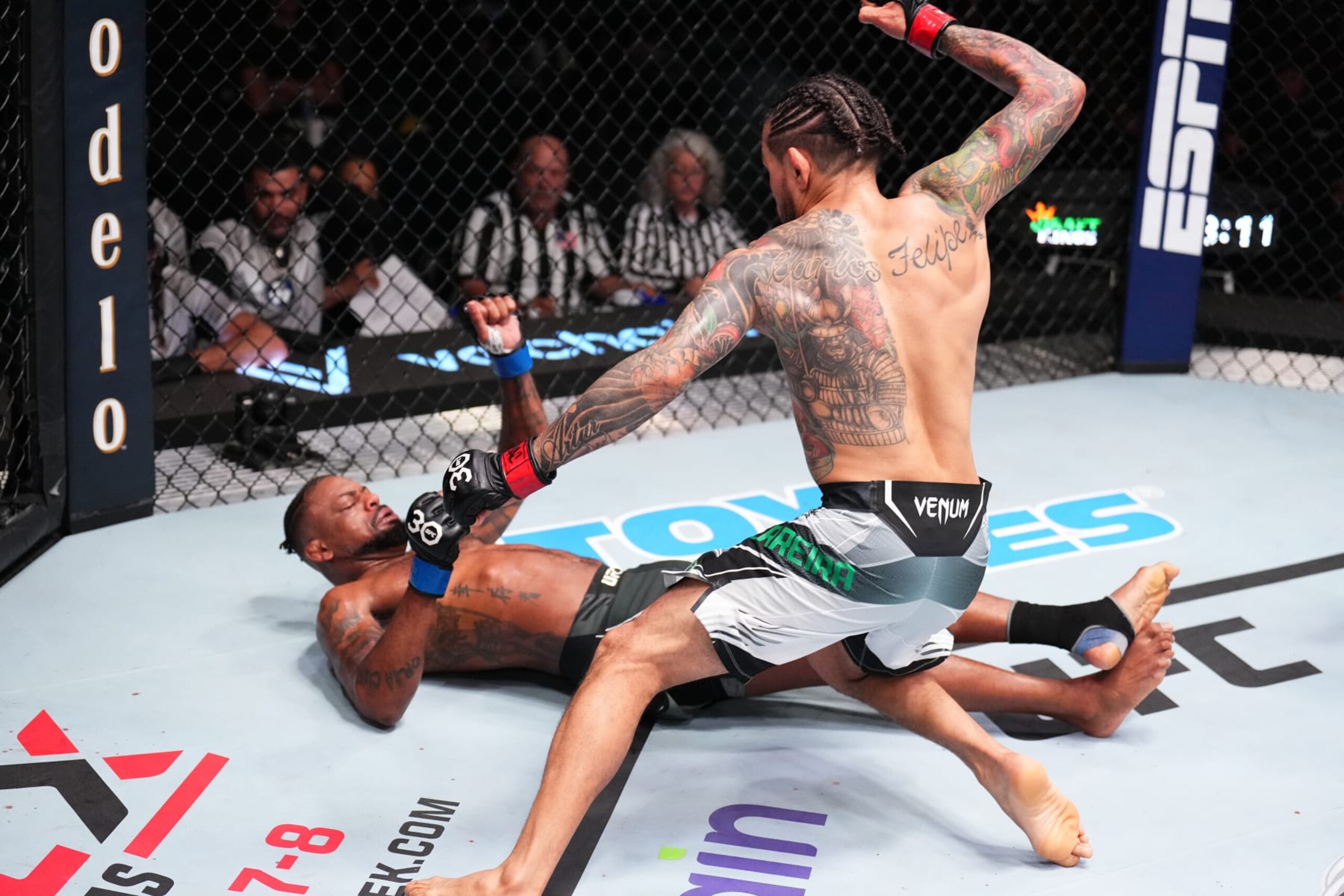 LAS VEGAS, NEVADA - MAY 20: (R-L) Diego Ferreira of Brazil knock outs Michael Johnson in a lightweight fight during the UFC Fight Night event at UFC APEX on May 20, 2023 in Las Vegas, Nevada. (Photo by Chris Unger/Zuffa LLC via Getty Images)