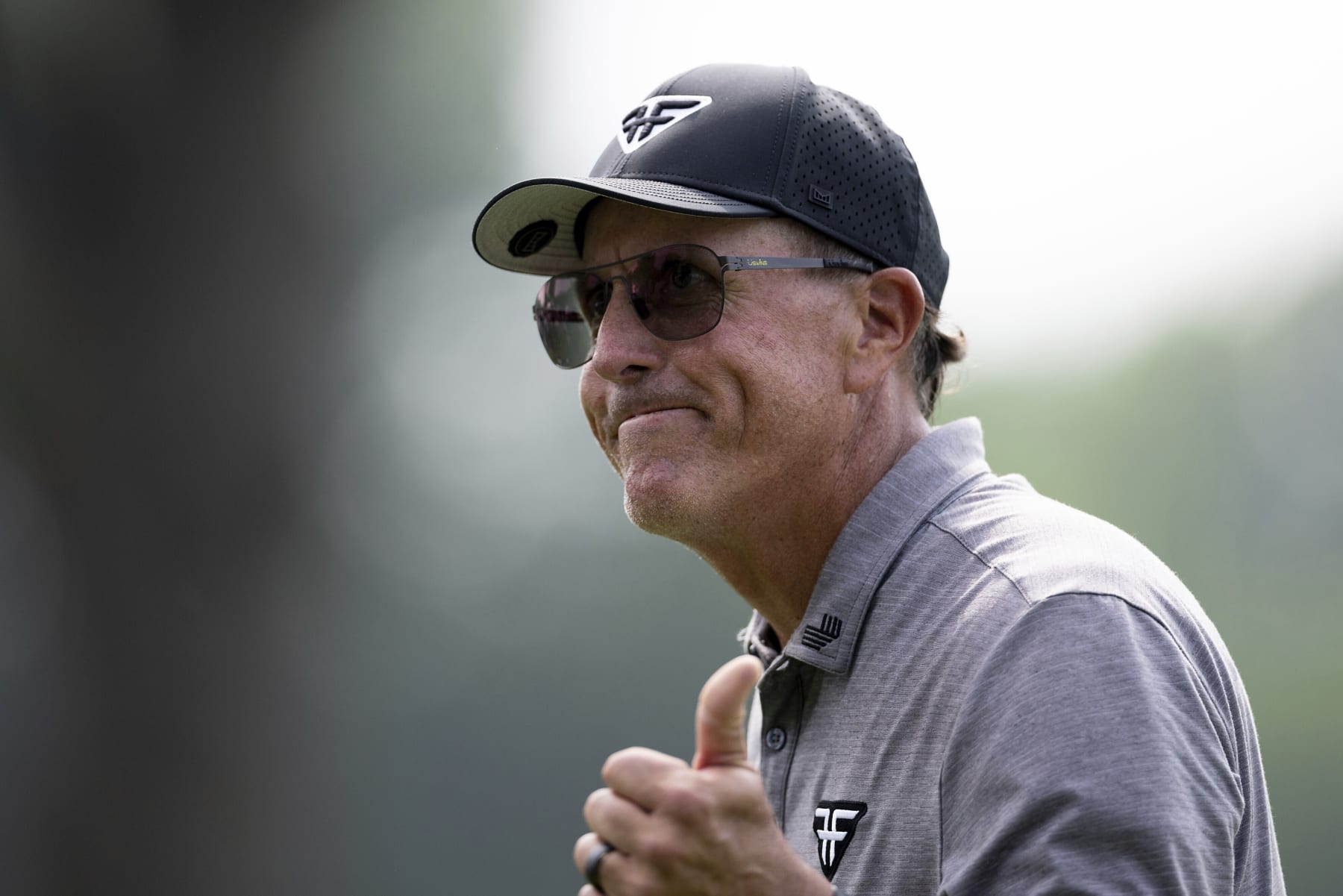 Captain Phil Mickelson of HyFlyers GC reacts on the 18th green during the first round of LIV Golf Tulsa at the Cedar Ridge Country Club on Friday, May. 12, 2023 in Broken Arrow, Oklahoma. (Photo by Katelyn Mulcahy/LIV Golf via AP)