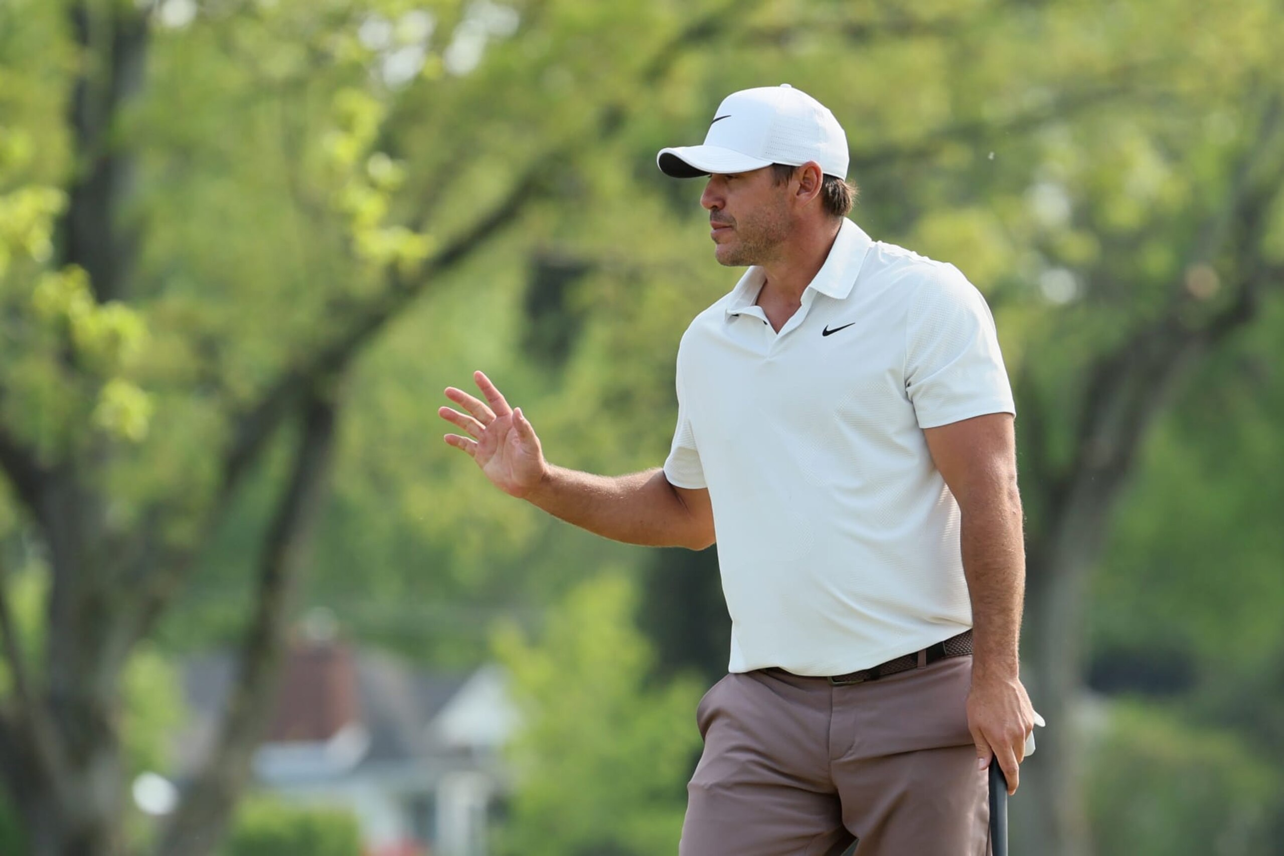 ROCHESTER, NEW YORK - MAY 21: Brooks Koepka of the United States waves after making birdie on the tenth green during the final round of the 2023 PGA Championship at Oak Hill Country Club on May 21, 2023 in Rochester, New York. (Photo by Andy Lyons/Getty Images)