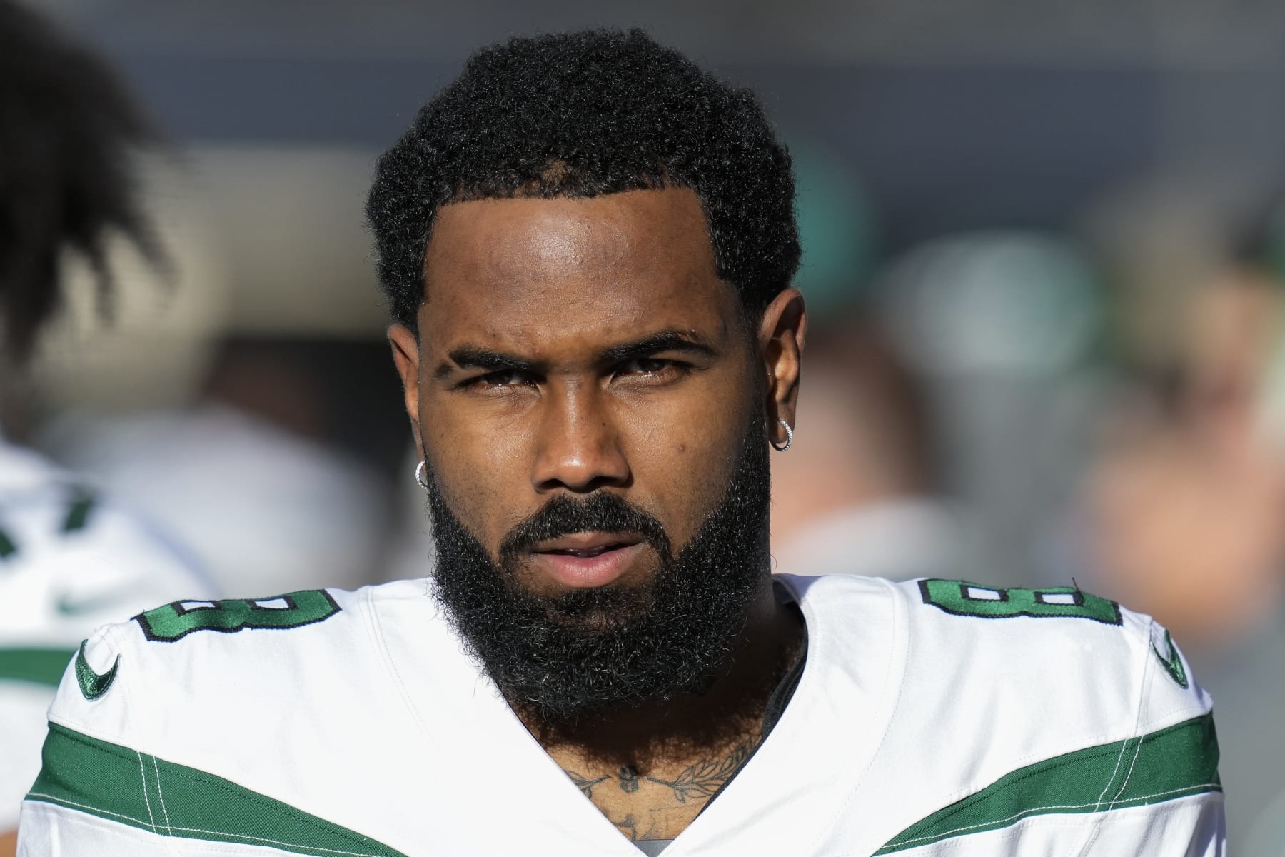New York Jets wide receiver Elijah Moore stands on the sideline before an NFL football game against the Seattle Seahawks, Sunday, Jan. 1, 2023, in Seattle. (AP Photo/Godofredo A. Vásquez)