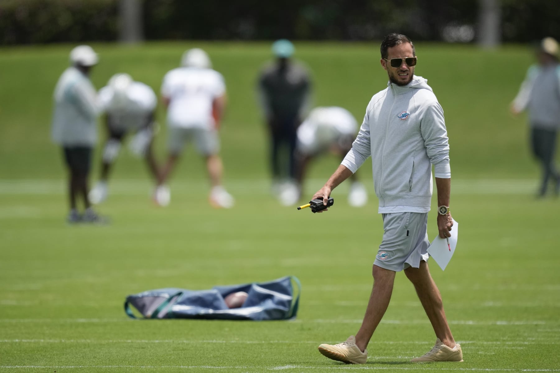 Miami Dolphins head coach Mike McDaniel watches as players participate in the the NFL football team's rookie minicamp in Miami Gardens, Fla., Friday, May 12, 2023. (AP Photo/Rebecca Blackwell)