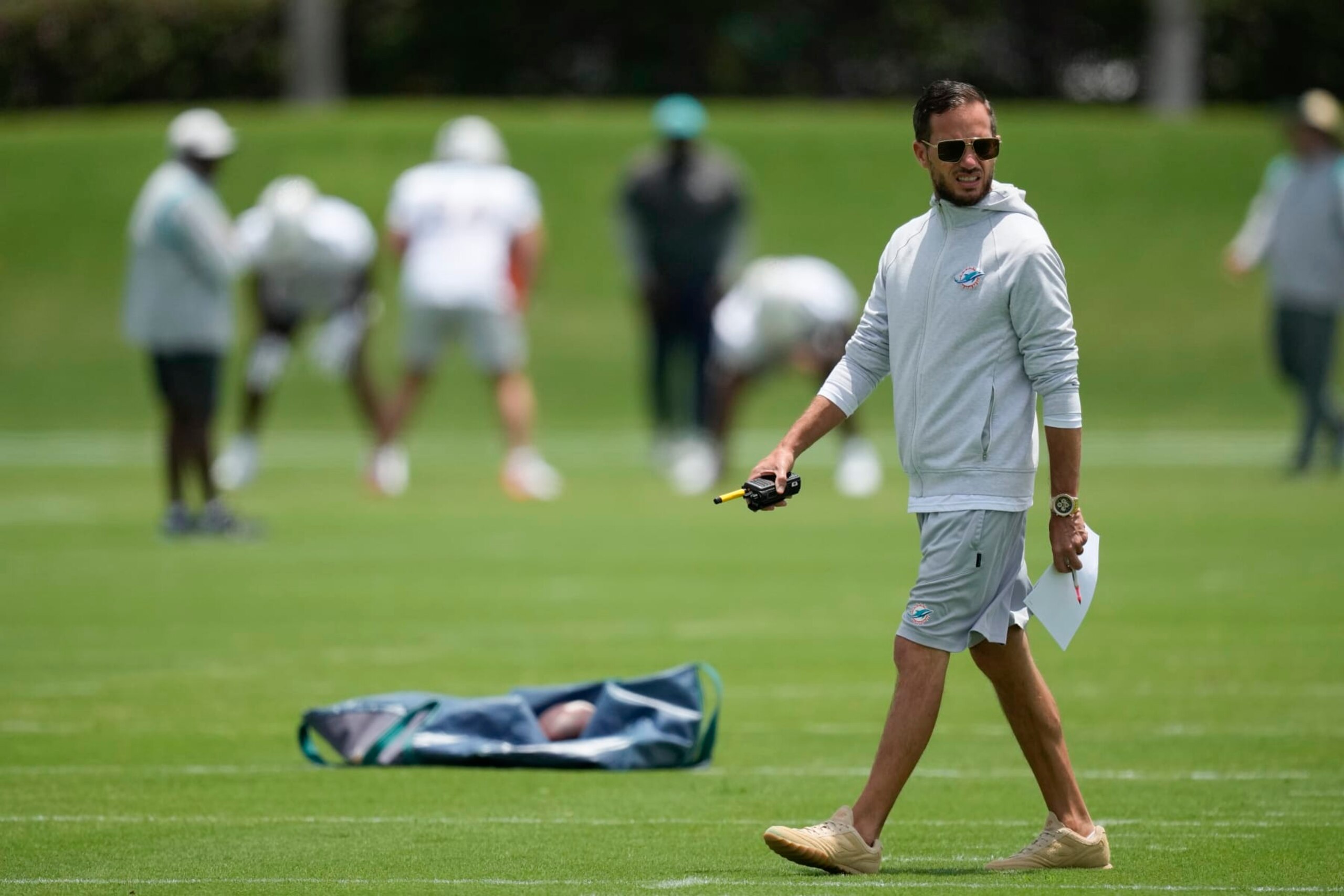 Miami Dolphins head coach Mike McDaniel watches as players participate in the the NFL football team's rookie minicamp in Miami Gardens, Fla., Friday, May 12, 2023. (AP Photo/Rebecca Blackwell)
