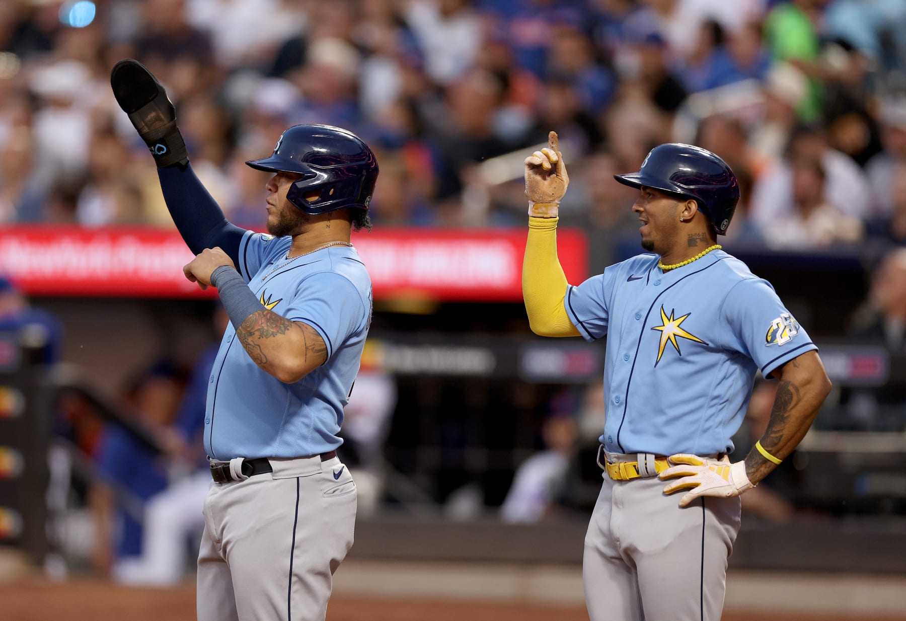 NEW YORK, NEW YORK - MAY 16:  Harold Ramirez #43 and Wander Franco #5 of the Tampa Bay Rays signal to teammate Isaac Paredes that he hit a home run and not a double in the third inning against the New York Mets at Citi Field on May 16, 2023 in the Flushing neighborhood of the Queens borough of New York City. (Photo by Elsa/Getty Images)