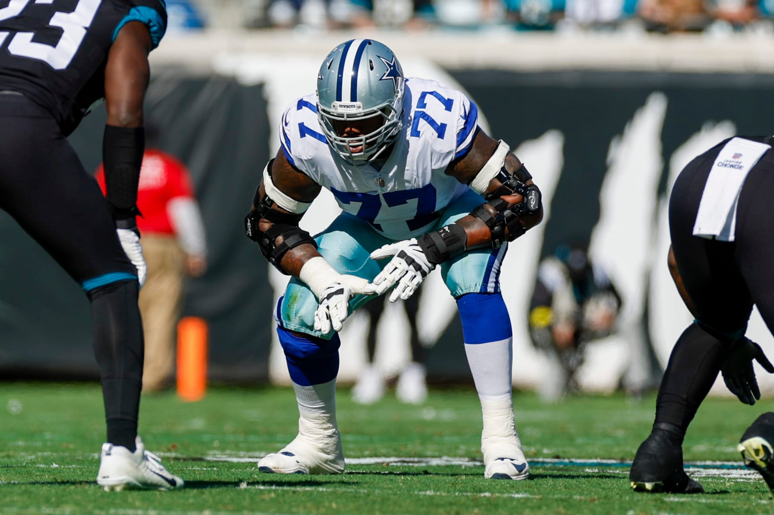 JACKSONVILLE, FL - DECEMBER 18: Dallas Cowboys offensive tackle Tyron Smith (77) lines up for a play during the game between the Dallas Cowboys and the Jacksonville Jaguars on December 18, 2022 at tIAA Bank Field in Jacksonville, Fl. (Photo by David Rosenblum/Icon Sportswire via Getty Images)