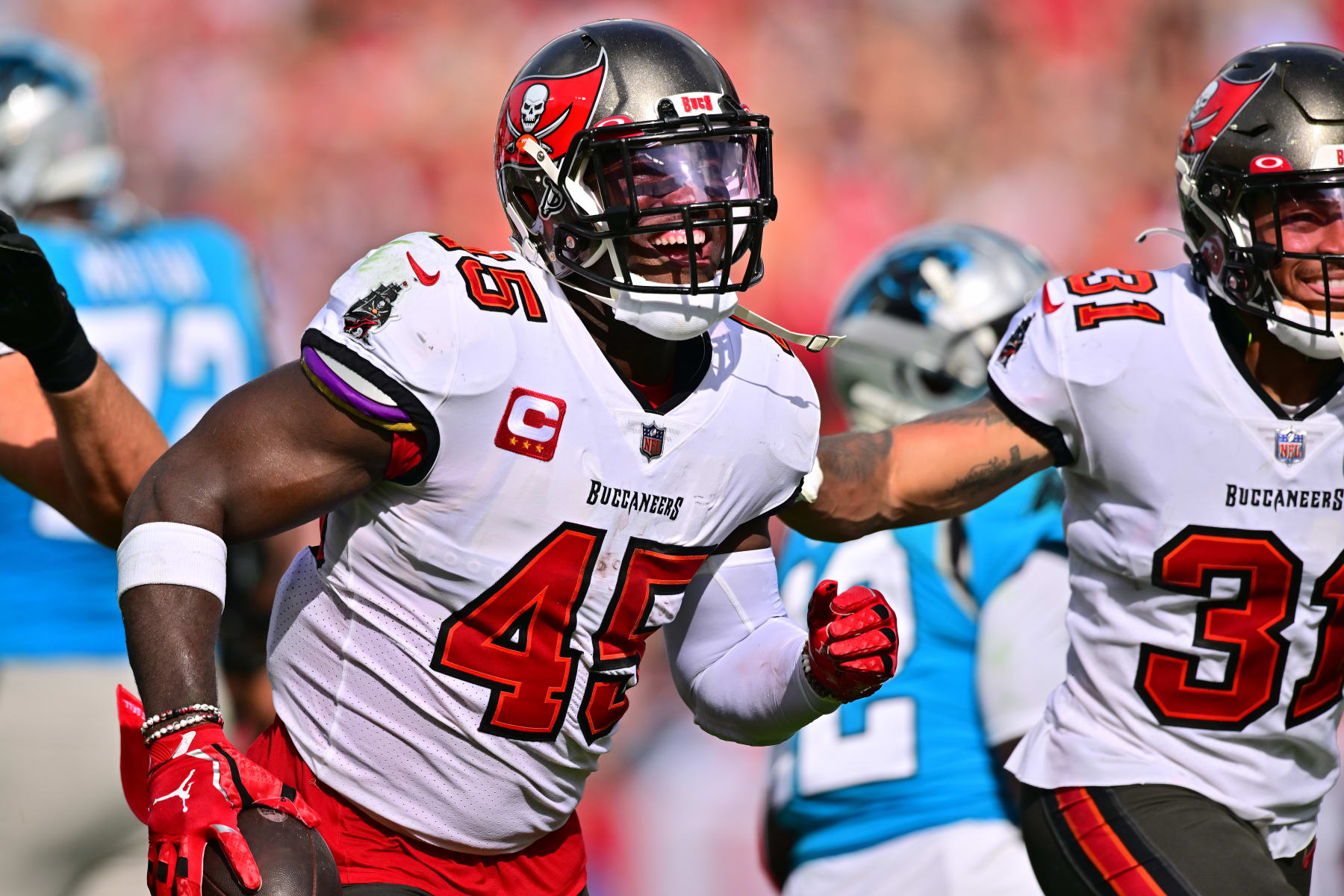 TAMPA, FLORIDA - JANUARY 01: Devin White #45 of the Tampa Bay Buccaneers celebrates after recovering a fumble during the second quarter against the Carolina Panthers at Raymond James Stadium on January 01, 2023 in Tampa, Florida. (Photo by Julio Aguilar/Getty Images)