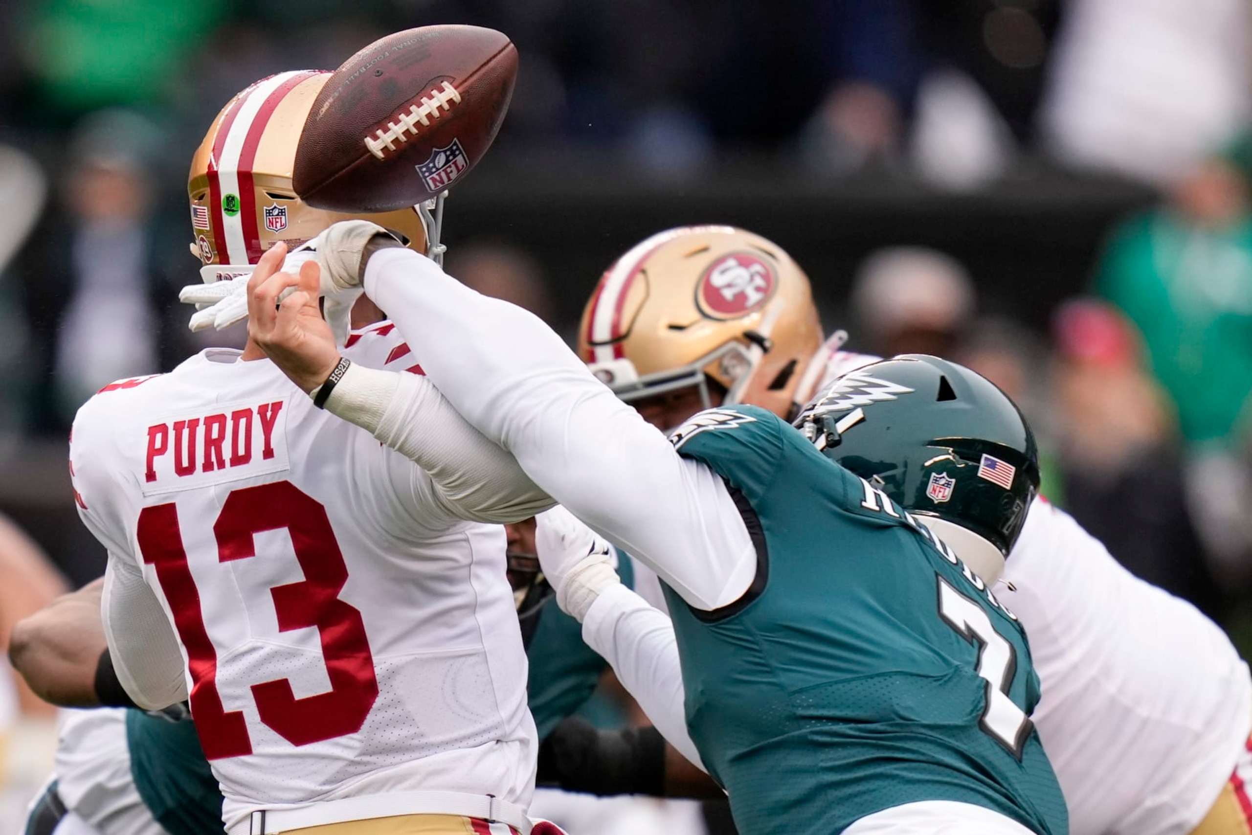 FILE - Philadelphia Eagles linebacker Haason Reddick, right, causes a fumble by San Francisco 49ers quarterback Brock Purdy during the first half of the NFC Championship NFL football game between the Philadelphia Eagles and the San Francisco 49ers on Jan. 29, 2023, in Philadelphia. Purdy's delayed surgery could happen early March 2023 if the swelling in his injured elbow has been reduced, general manager John Lynch said on Tuesday, Feb. 28, 2023. (AP Photo/Seth Wenig, File) FILE - Philadelphia Eagles linebacker Haason Reddick, right, causes a fumble by San Francisco 49ers quarterback Brock Purdy during the first half of the NFC Championship NFL football game between the Philadelphia Eagles and the San Francisco 49ers on Jan. 29, 2023, in Philadelphia. Purdy's delayed surgery could happen early March 2023 if the swelling in his injured elbow has been reduced, general manager John Lynch said on Tuesday, Feb. 28, 2023. (AP Photo/Seth Wenig, File)