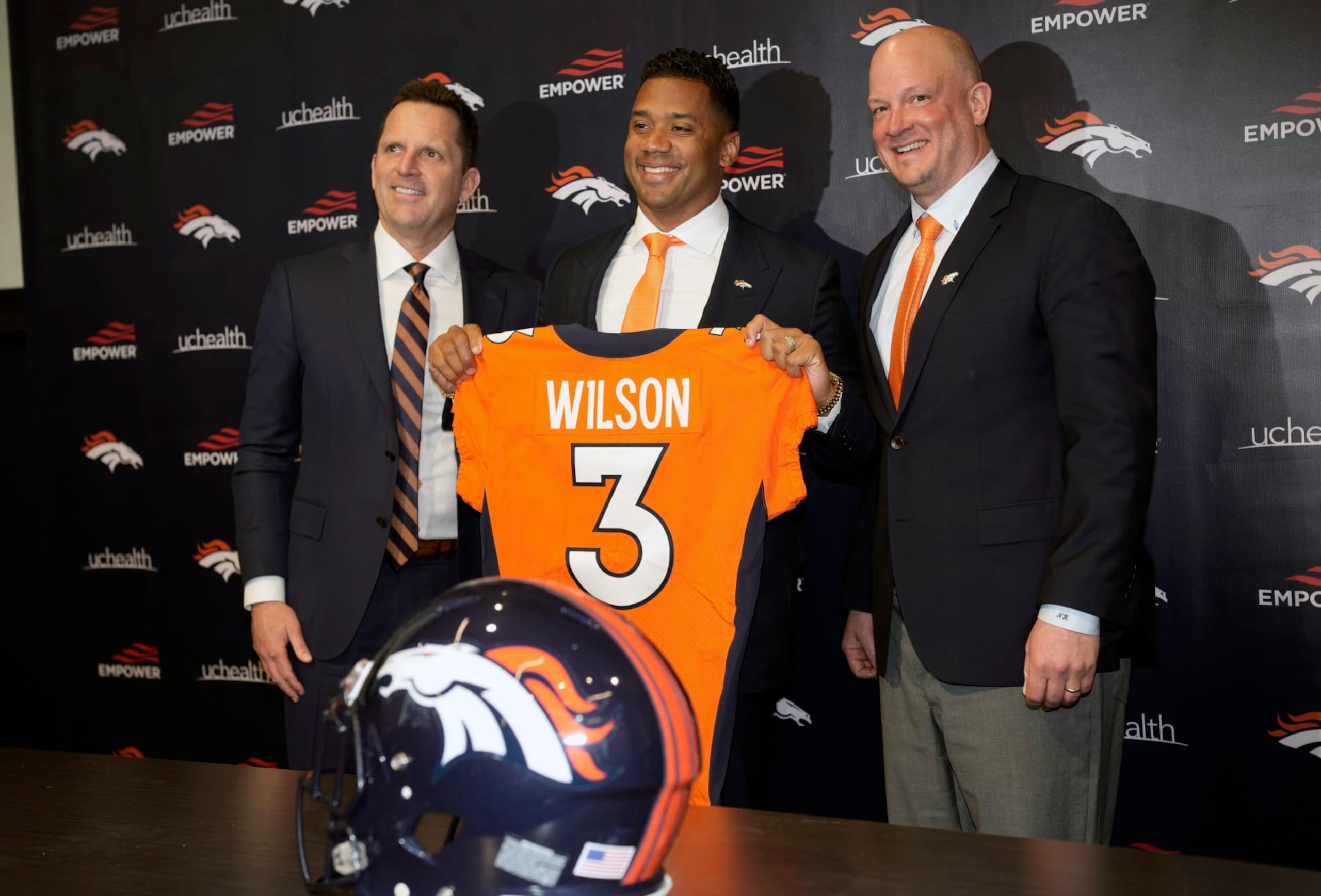 FILE - Denver Broncos new starting quarterback Russell Wilson, center, is flanked by coach Nathaniel Hackett, right, and general manager George Paton after a news conference March 16, 2022, in Englewood, Colo. Hackett said there's never “too high of a price on anybody that’s great" — especially when it comes to quarterbacks. Denver had been dealing with a revolving door of mediocrity at the most important position ever since Peyton Manning retired seven years ago but now has Wilson in place. (AP Photo/David Zalubowski, File) FILE - Denver Broncos new starting quarterback Russell Wilson, center, is flanked by coach Nathaniel Hackett, right, and general manager George Paton after a news conference March 16, 2022, in Englewood, Colo. Hackett said there's never “too high of a price on anybody that’s great" — especially when it comes to quarterbacks. Denver had been dealing with a revolving door of mediocrity at the most important position ever since Peyton Manning retired seven years ago but now has Wilson in place. (AP Photo/David Zalubowski, File)