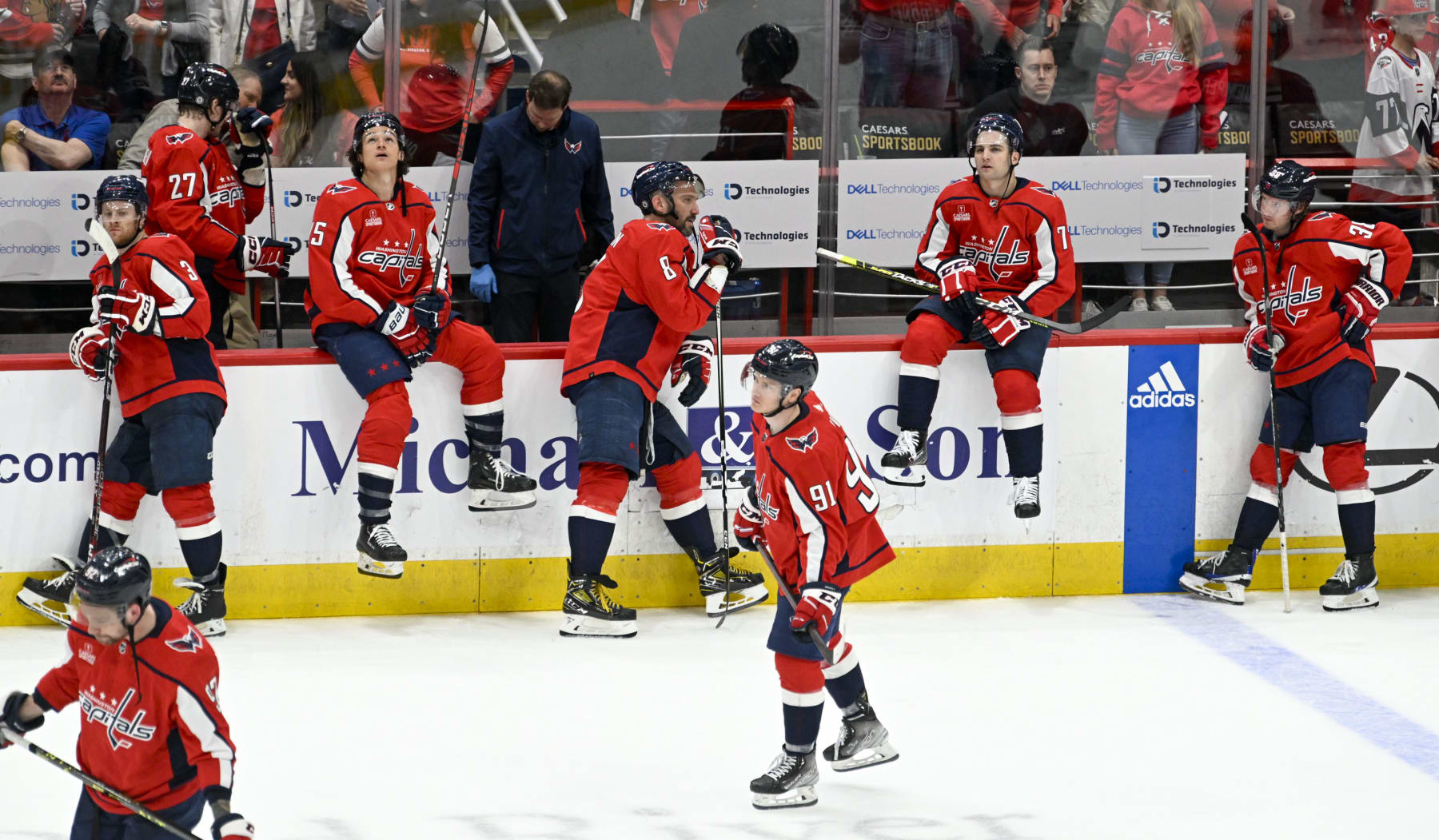 WASHINGTON, DC - APRIL 13:  Washington Capitals left wing Alex Ovechkin (8) and his teammates react after losing to the New Jersey Devils in overtime during the final game of the season at Capital One Arena on April 13, 2023.  (Photo by Jonathan Newton/The Washington Post via Getty Images)