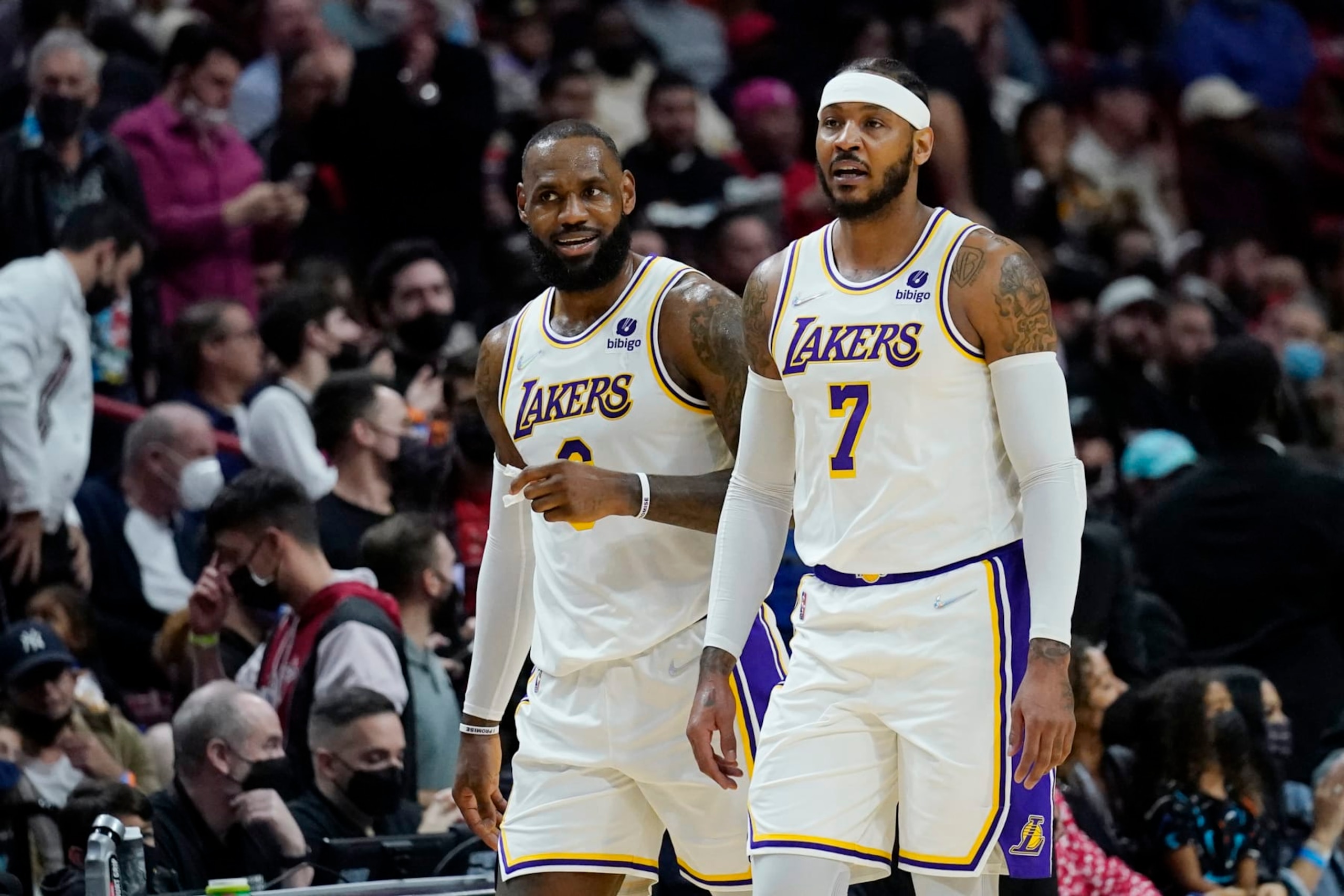 Los Angeles Lakers forward LeBron James, left talks with forward Carmelo Anthony (7) during the first half of an NBA basketball game against the Miami Heat, Sunday, Jan. 23, 2022, in Miami. (AP Photo/Lynne Sladky) Los Angeles Lakers forward LeBron James, left talks with forward Carmelo Anthony (7) during the first half of an NBA basketball game against the Miami Heat, Sunday, Jan. 23, 2022, in Miami. (AP Photo/Lynne Sladky)