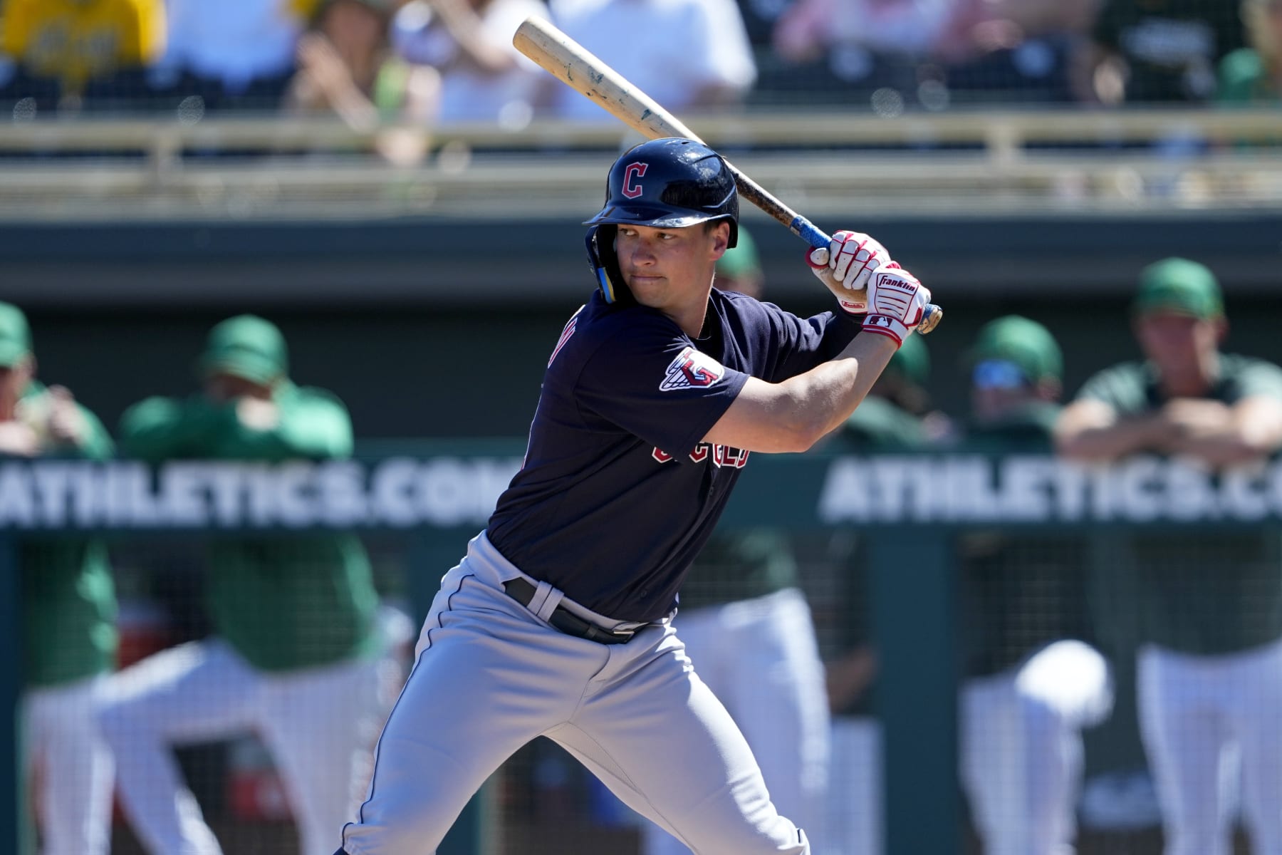 Cleveland Guardians' Will Brennan hits against the Oakland Athletics during the first inning of a spring training baseball game, Saturday, March 4, 2023, in Mesa, Ariz. (AP Photo/Matt York)
