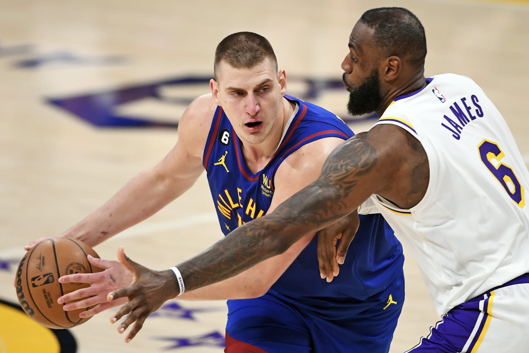 LOS ANGELES, CALIFORNIA - MAY 20: Nikola Jokic #15 of the Denver Nuggets handles the ball against LeBron James #6 of the Los Angeles Lakers during the fourth quarter in game three of the Western Conference Finals at Crypto.com Arena on May 20, 2023 in Los Angeles, California. NOTE TO USER: User expressly acknowledges and agrees that, by downloading and or using this photograph, User is consenting to the terms and conditions of the Getty Images License Agreement. (Photo by Kevork Djansezian/Getty Images)
