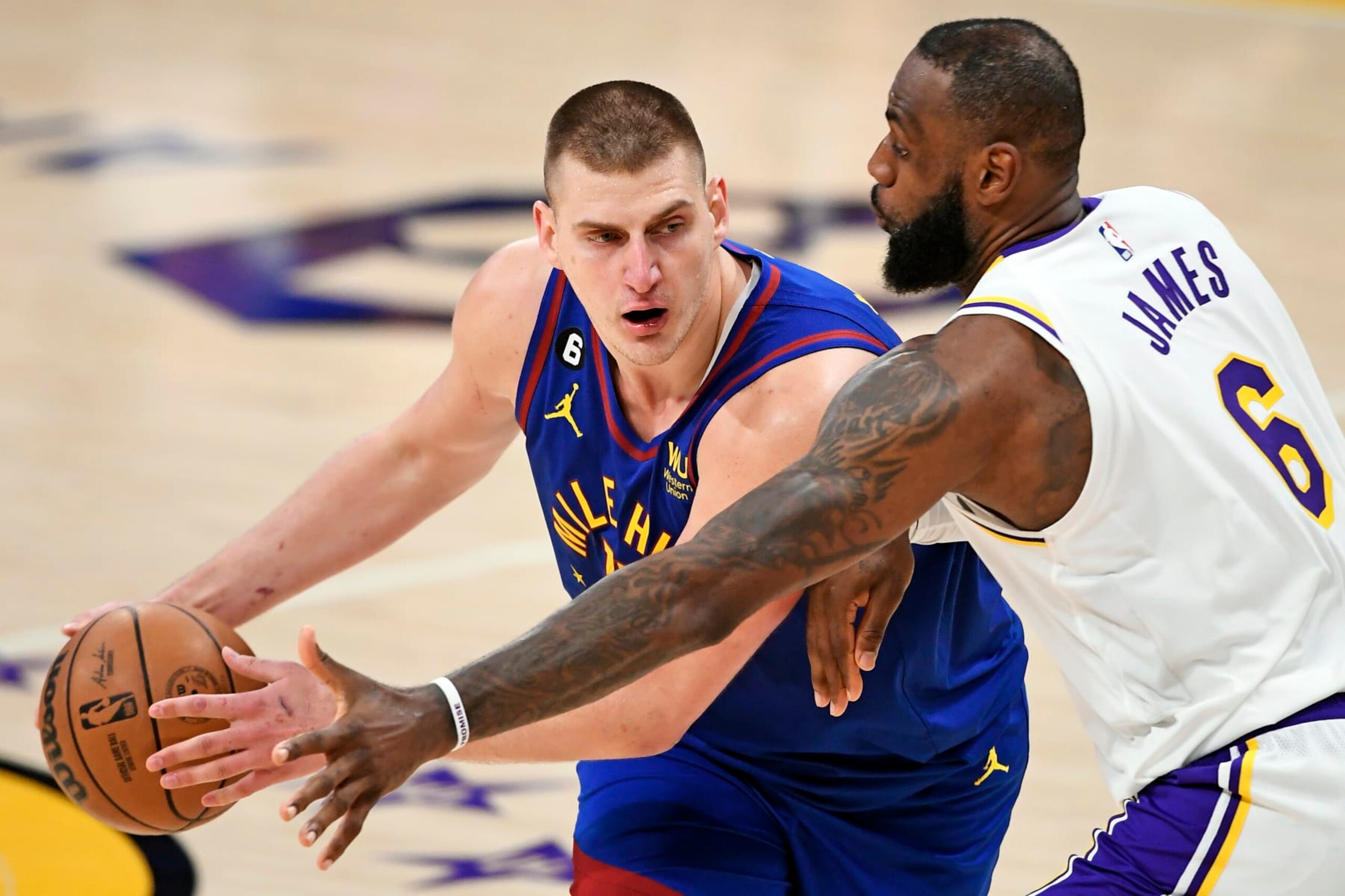 LOS ANGELES, CALIFORNIA - MAY 20: Nikola Jokic #15 of the Denver Nuggets handles the ball against LeBron James #6 of the Los Angeles Lakers during the fourth quarter in game three of the Western Conference Finals at Crypto.com Arena on May 20, 2023 in Los Angeles, California. NOTE TO USER: User expressly acknowledges and agrees that, by downloading and or using this photograph, User is consenting to the terms and conditions of the Getty Images License Agreement. (Photo by Kevork Djansezian/Getty Images)