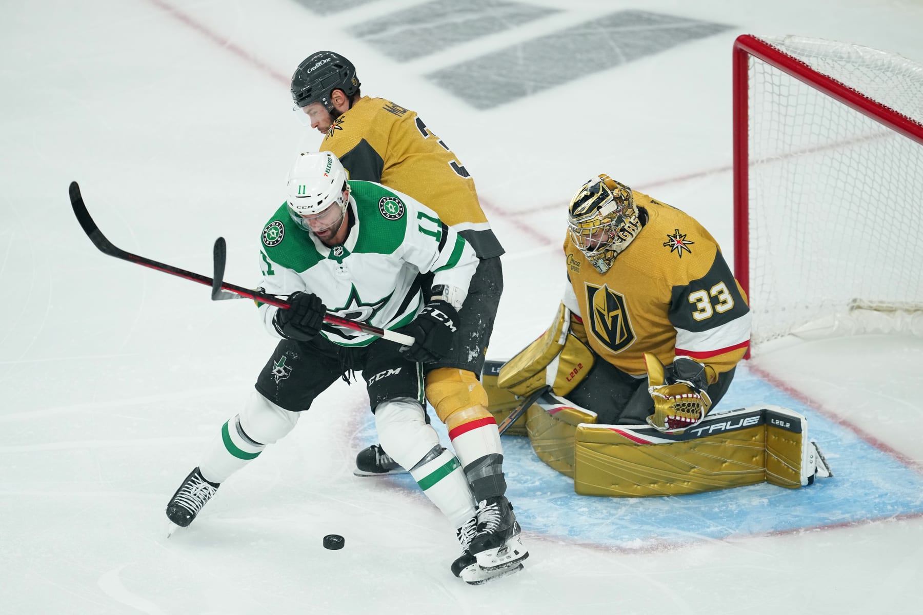 LAS VEGAS, NEVADA - MAY 21: Luke Glendening #11 of the Dallas Stars is pressured by Brayden McNabb #3 of the Vegas Golden Knights in front of Adin Hill #33 during the first period in Game Two of the Western Conference Final of the 2023 Stanley Cup Playoffs at T-Mobile Arena on May 21, 2023 in Las Vegas, Nevada. (Photo by Chris Unger/Getty Images)
