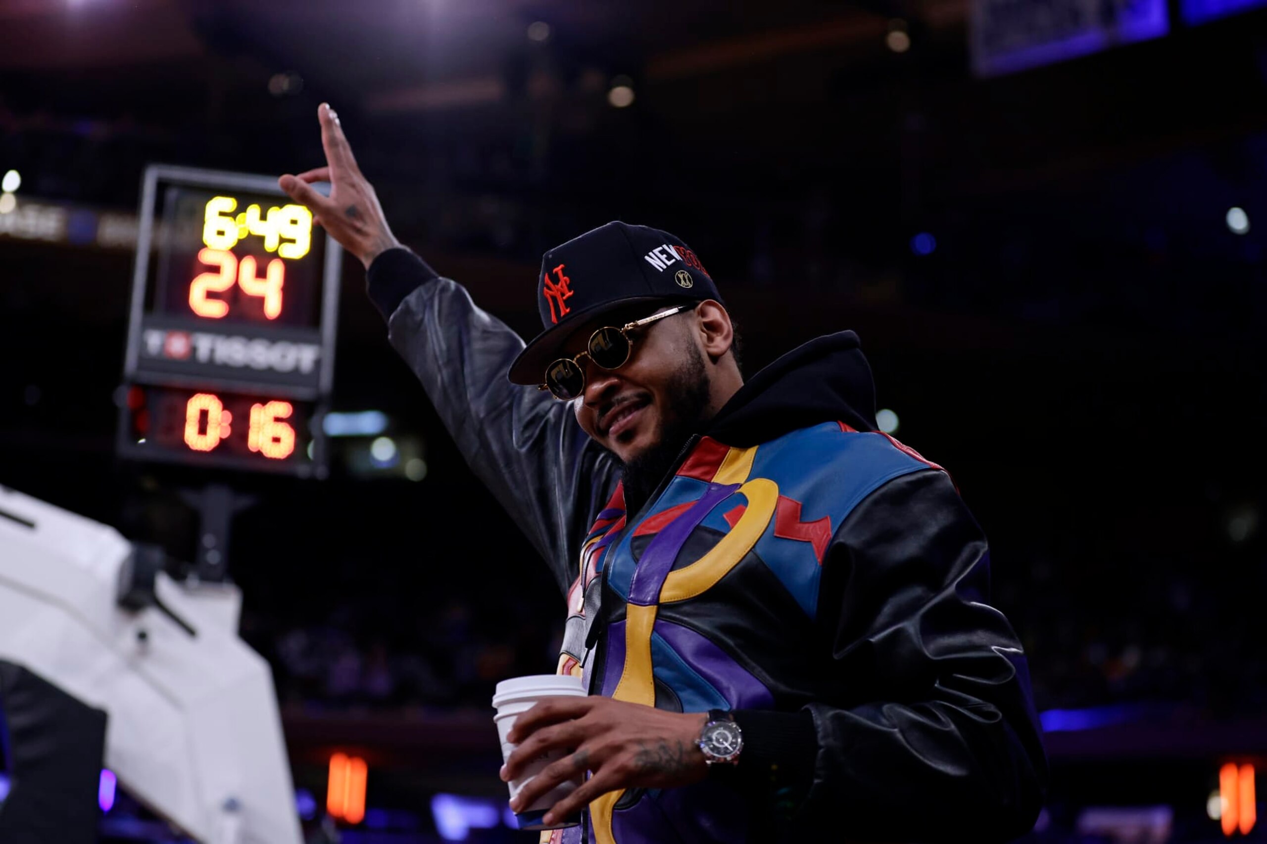 Former New York Knicks' Carmelo Anthony acknowledges the crowd during the first half of an NBA basketball game against the Philadelphia 76ers on Sunday, Dec. 25, 2022, in New York. (AP Photo/Adam Hunger)