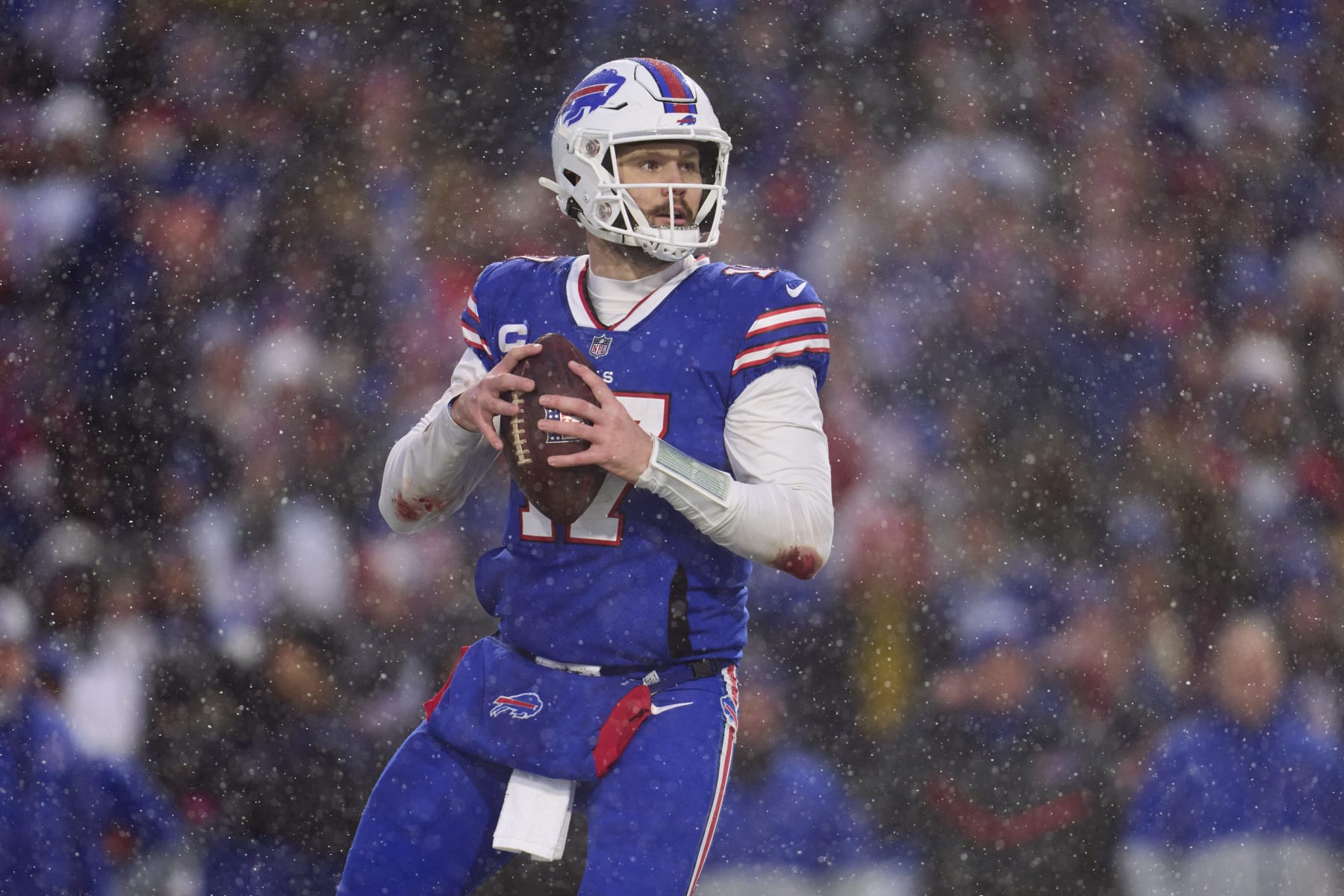 ORCHARD PARK, NY - JANUARY 22: Josh Allen #17 of the Buffalo Bills drops back to pass against the Cincinnati Bengals during the second half at Highmark Stadium on January 22, 2023 in Orchard Park, New York. (Photo by Cooper Neill/Getty Images)