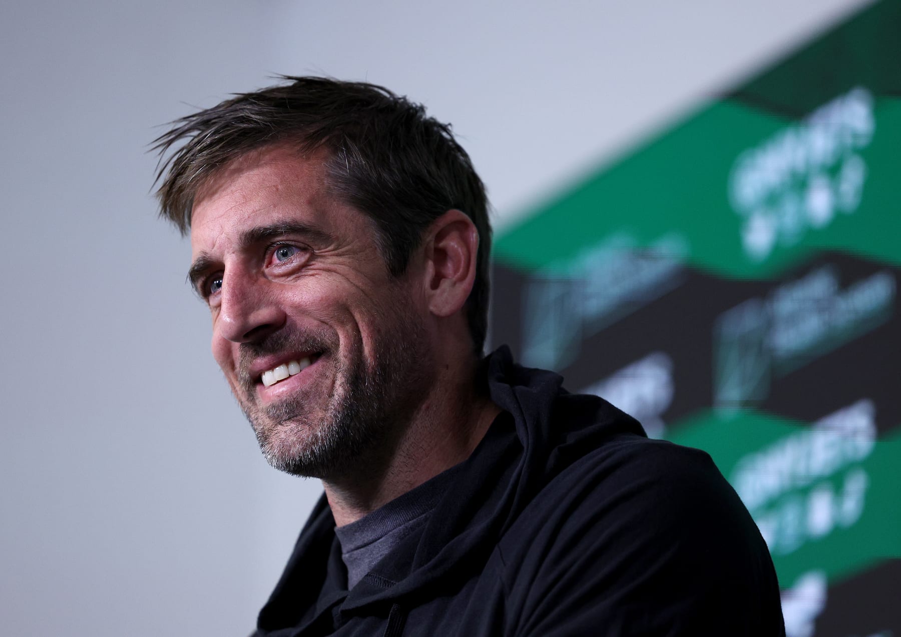 FLORHAM PARK, NEW JERSEY - MAY 23: Aaron Rodgers #8 of the New York Jets answers questions after an offseason workout session at Atlantic Health Jets Training Center on May 23, 2023 in Florham Park, New Jersey. (Photo by Elsa/Getty Images)