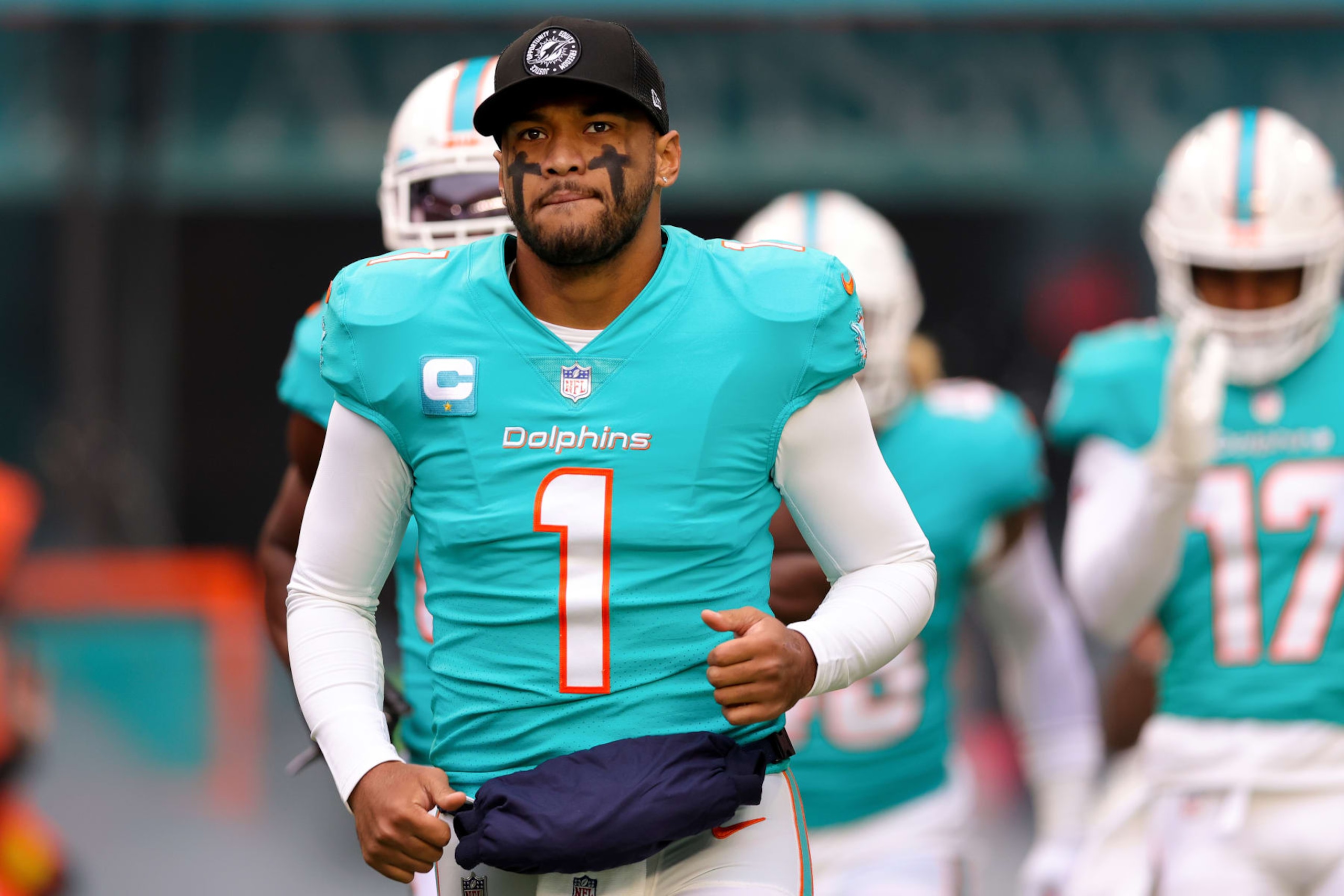 MIAMI GARDENS, FLORIDA - DECEMBER 25: Tua Tagovailoa #1 of the Miami Dolphins takes the field prior to a game against the Green Bay Packers at Hard Rock Stadium on December 25, 2022 in Miami Gardens, Florida. (Photo by Megan Briggs/Getty Images) MIAMI GARDENS, FLORIDA - DECEMBER 25: Tua Tagovailoa #1 of the Miami Dolphins takes the field prior to a game against the Green Bay Packers at Hard Rock Stadium on December 25, 2022 in Miami Gardens, Florida. (Photo by Megan Briggs/Getty Images)