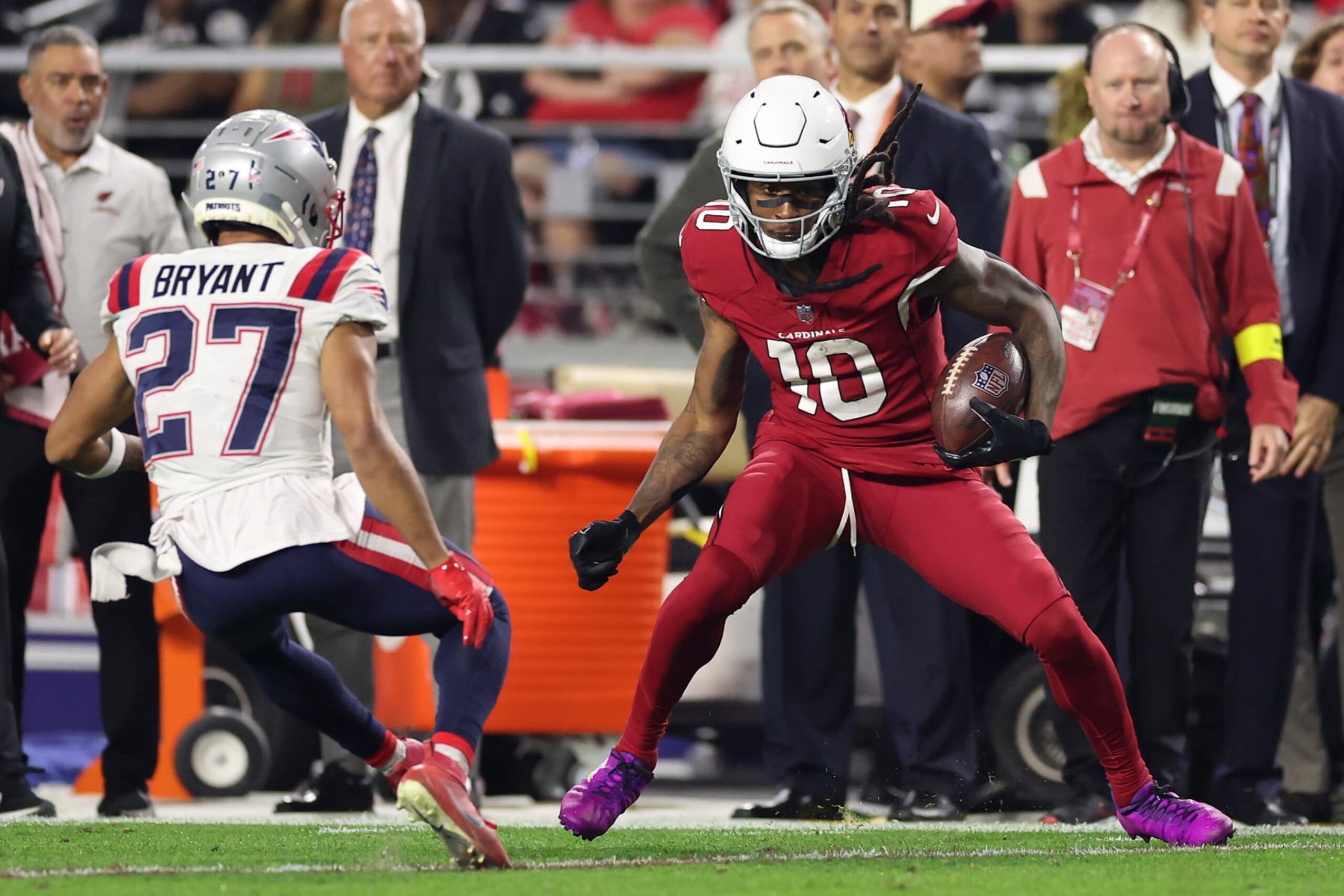 GLENDALE, ARIZONA - DECEMBER 12: DeAndre Hopkins #10 of the Arizona Cardinals makes a catch against Myles Bryant #27 of the New England Patriots during the second quarter of the game at State Farm Stadium on December 12, 2022 in Glendale, Arizona. (Photo by Christian Petersen/Getty Images)
