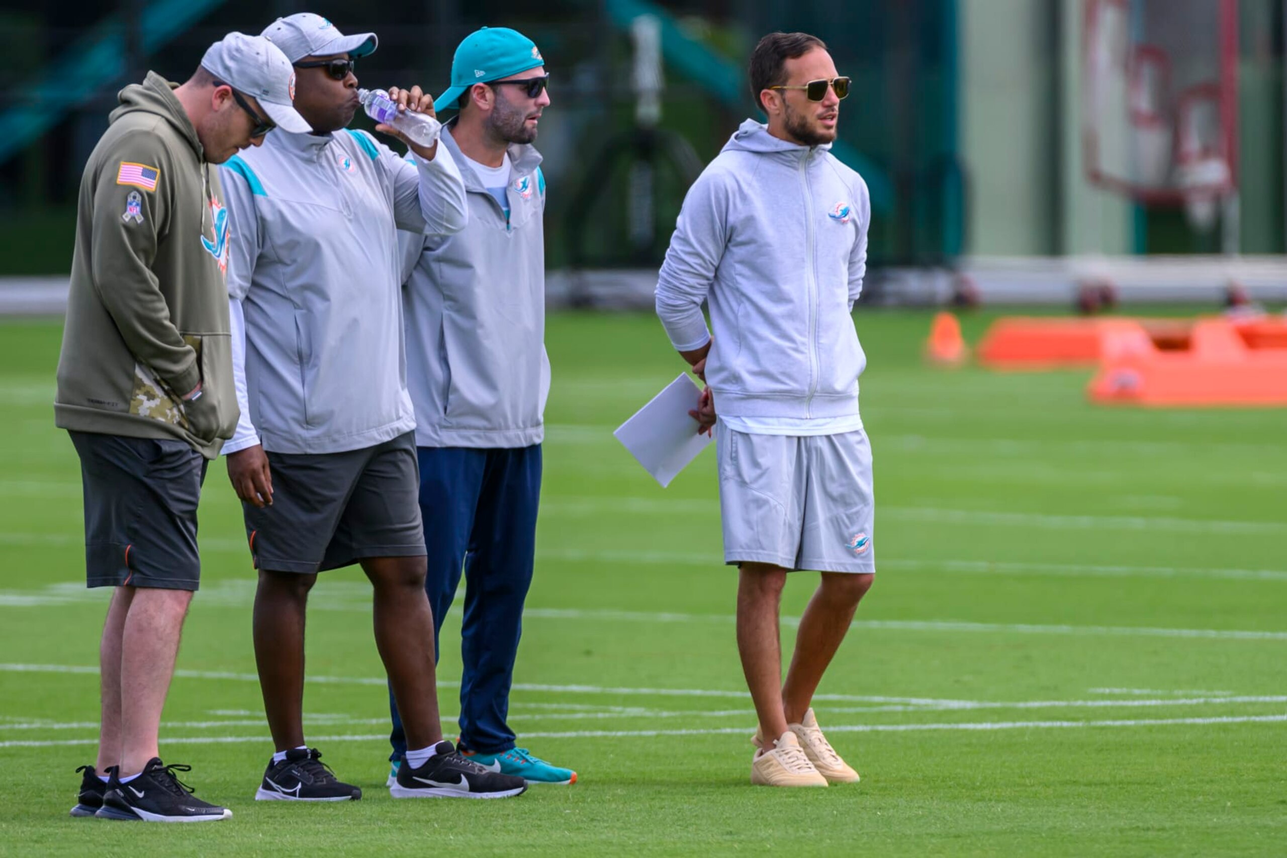 MIAMI GARDENS, FL - MAY 12: From right, Miami Dolphins head coach Mike McDaniel and Miami Dolphins wide receivers coach Wes Walker watches the players on the field during the rookie minicamp at the Baptist Health Training Complex on May 12, 2023 in Miami Gardens, Florida. (Photo by Doug Murray/Icon Sportswire via Getty Images)