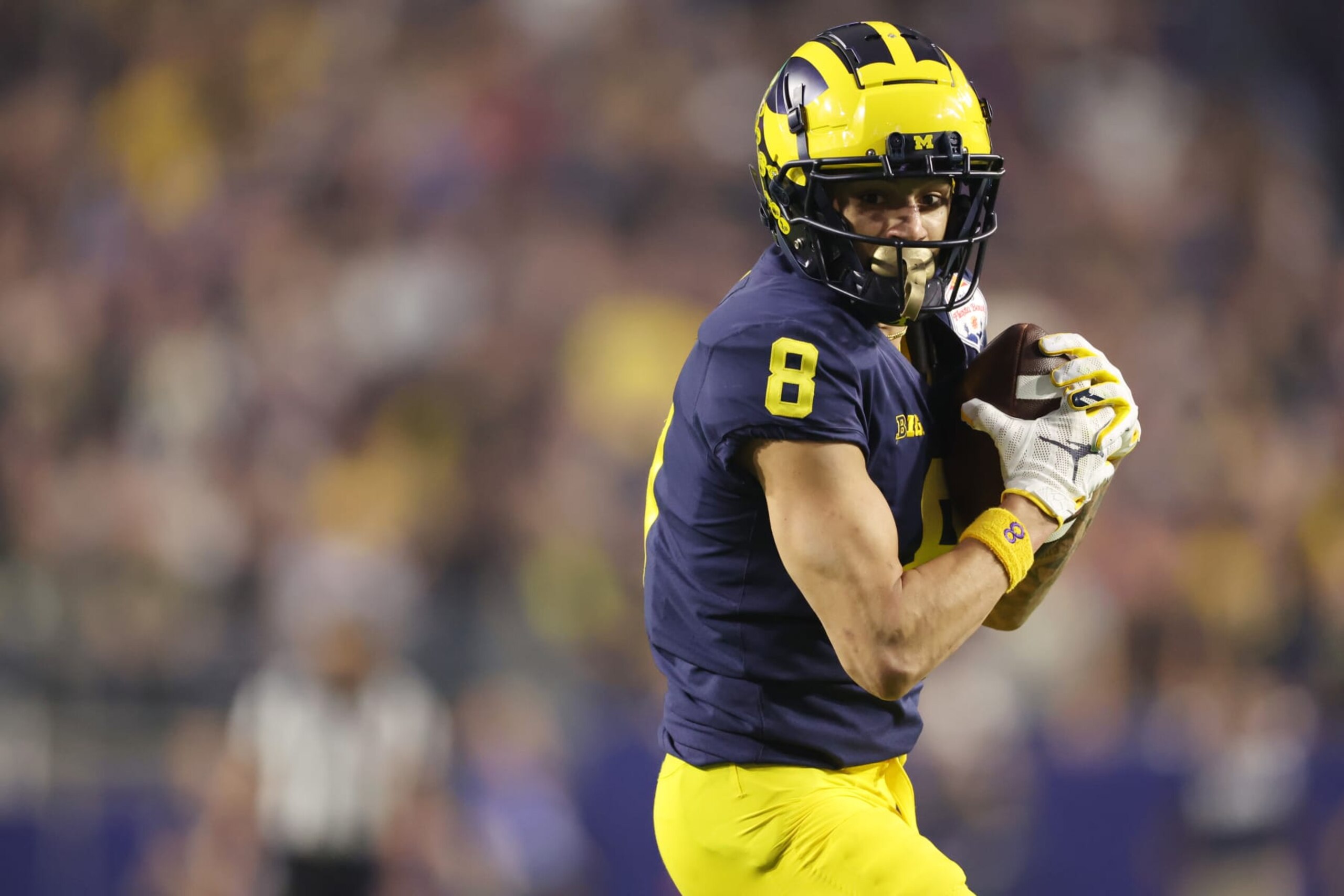 GLENDALE, ARIZONA - DECEMBER 31: Ronnie Bell #8 of the Michigan Wolverines catches a pass during the second half against the TCU Horned Frogs in the Vrbo Fiesta Bowl at State Farm Stadium on December 31, 2022 in Glendale, Arizona. (Photo by Christian Petersen/Getty Images)