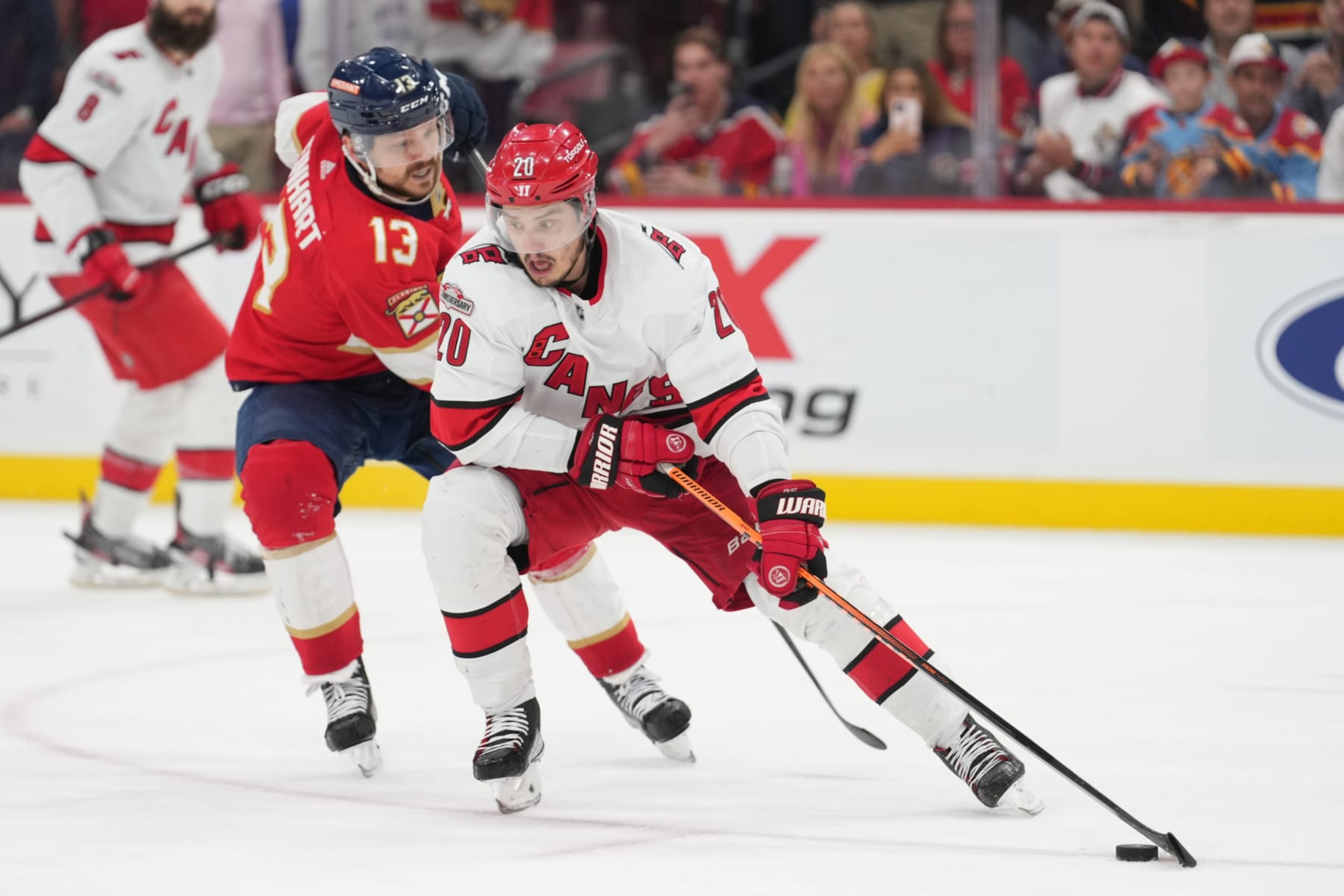 SUNRISE, FL - MAY 22: Florida Panthers center Sam Reinhart (13) pressures Carolina Hurricanes center Sebastian Aho (20) late in the third period during game three of the Eastern Conference Finals between the Carolina Hurricanes and the Florida Panthers on Monday, May 22, 2023 at FLA Live Arena in Sunrise, Fla. (Photo by Peter Joneleit/Icon Sportswire via Getty Images)