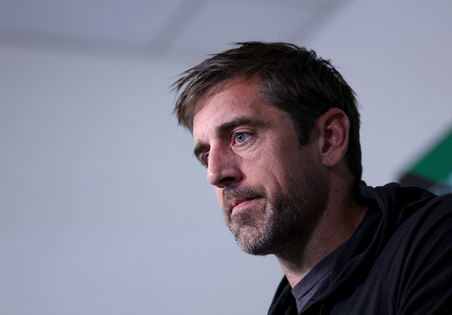FLORHAM PARK, NEW JERSEY - MAY 23: Aaron Rodgers #8 of the New York Jets answers questions after an offseason workout session at Atlantic Health Jets Training Center on May 23, 2023 in Florham Park, New Jersey. (Photo by Elsa/Getty Images)