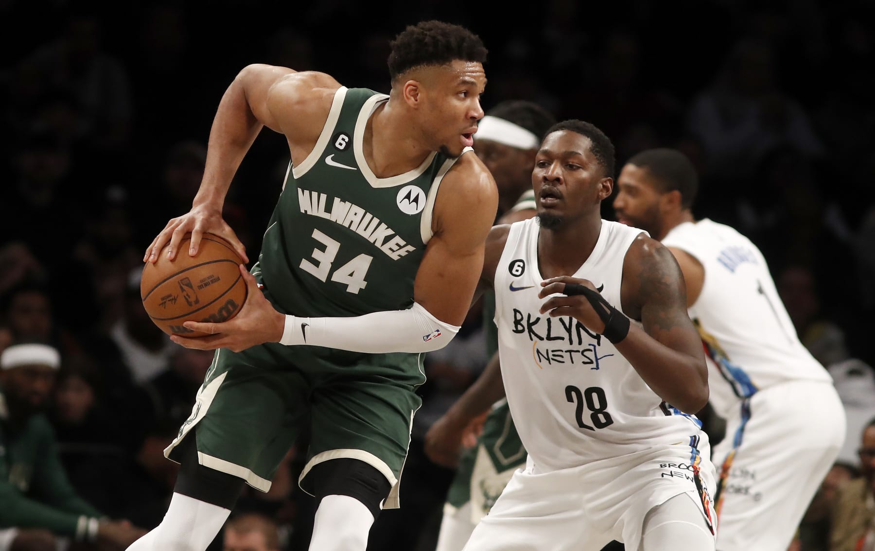 NEW YORK, NEW YORK - FEBRUARY 28: (NEW YORK DAILIES OUT)  Giannis Antetokounmpo #34 of the Milwaukee Bucks in action against Dorian Finney-Smith #28 of the Brooklyn Nets at Barclays Center on February 28, 2023 in New York City. The Bucks defeated the Knicks 118-104. NOTE TO USER: User expressly acknowledges and agrees that, by downloading and or using this photograph, User is consenting to the terms and conditions of the Getty Images License Agreement. (Photo by Jim McIsaac/Getty Images)