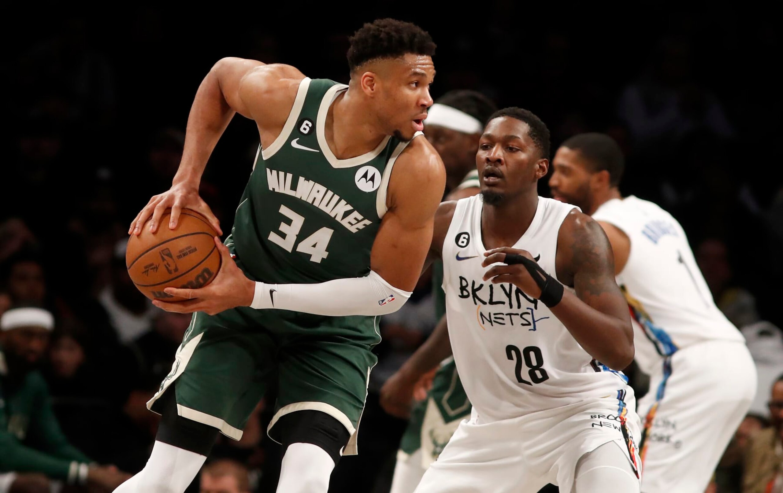 NEW YORK, NEW YORK - FEBRUARY 28: (NEW YORK DAILIES OUT)  Giannis Antetokounmpo #34 of the Milwaukee Bucks in action against Dorian Finney-Smith #28 of the Brooklyn Nets at Barclays Center on February 28, 2023 in New York City. The Bucks defeated the Knicks 118-104. NOTE TO USER: User expressly acknowledges and agrees that, by downloading and or using this photograph, User is consenting to the terms and conditions of the Getty Images License Agreement. (Photo by Jim McIsaac/Getty Images)