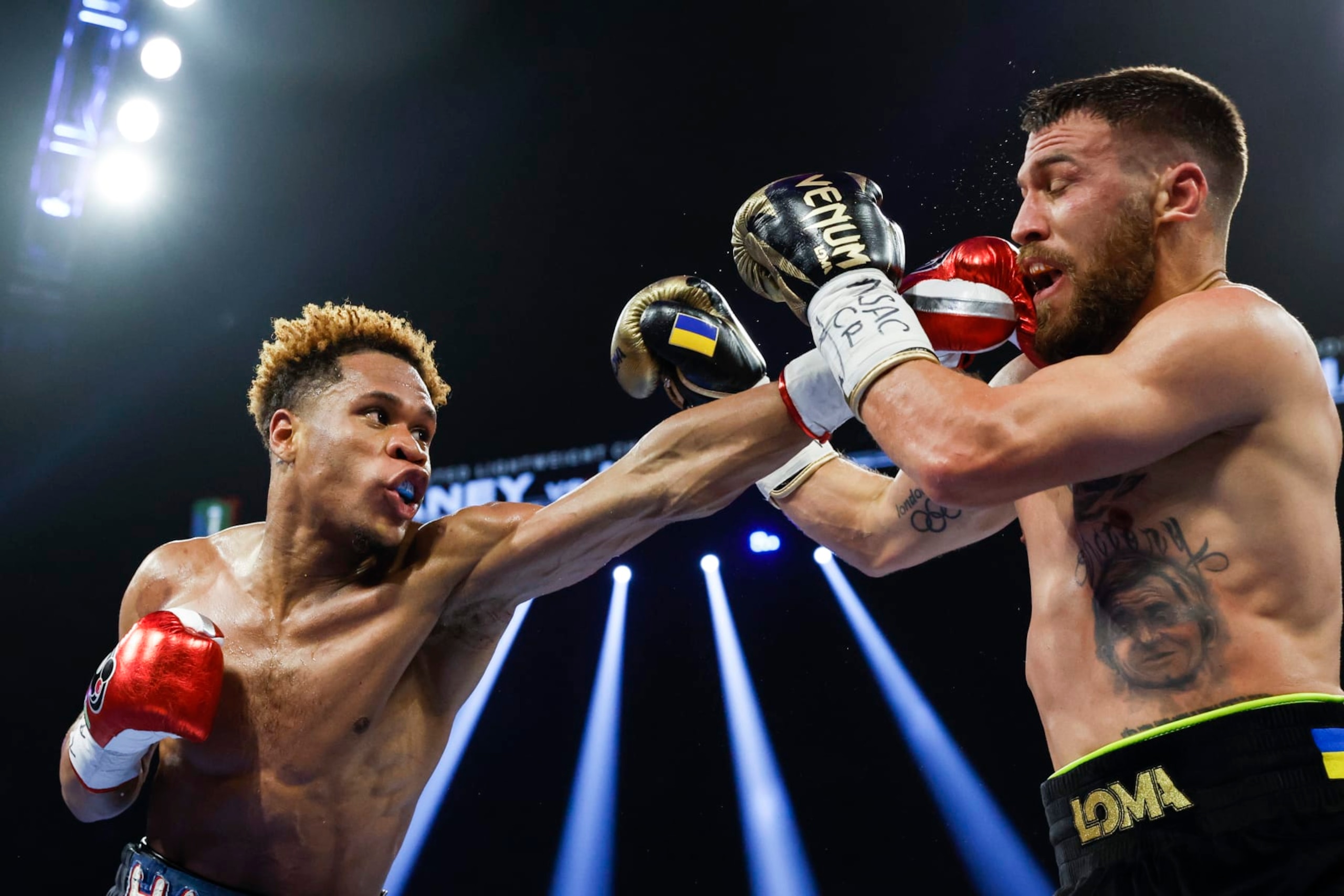 LAS VEGAS, NEVADA - MAY 20: Devin Haney punches Vasyl Lomachenko of Ukraine during their undisputed lightweight title bout at MGM Grand Garden Arena on May 20, 2023 in Las Vegas, Nevada. (Photo by Sarah Stier/Getty Images)