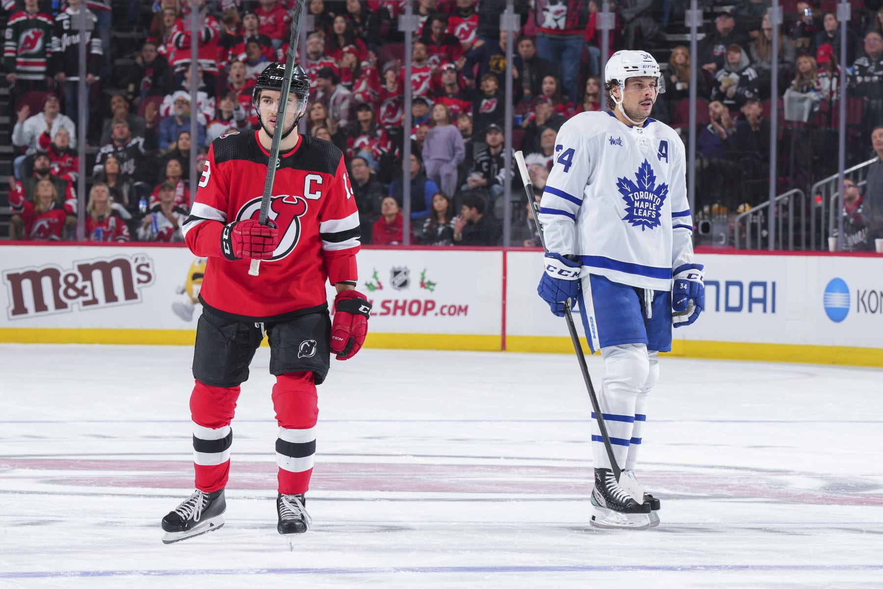 New Jersey Devils captain Nico Hischier (left) and Toronto Maple Leafs center Auston Matthews. 
