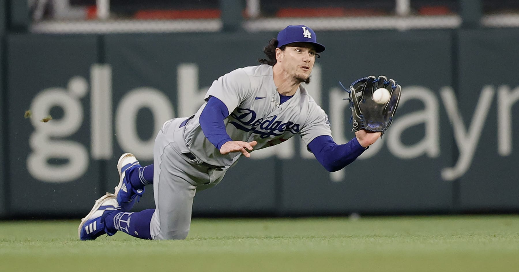 ATLANTA, GEORGIA - MAY 22: James Outman #33 of the Los Angeles Dodgers catches a fly ball hit by Eddie Rosario #8 of the Atlanta Braves in the fifth inning at Truist Park on May 22, 2023 in Atlanta, Georgia. (Photo by Alex Slitz/Getty Images)