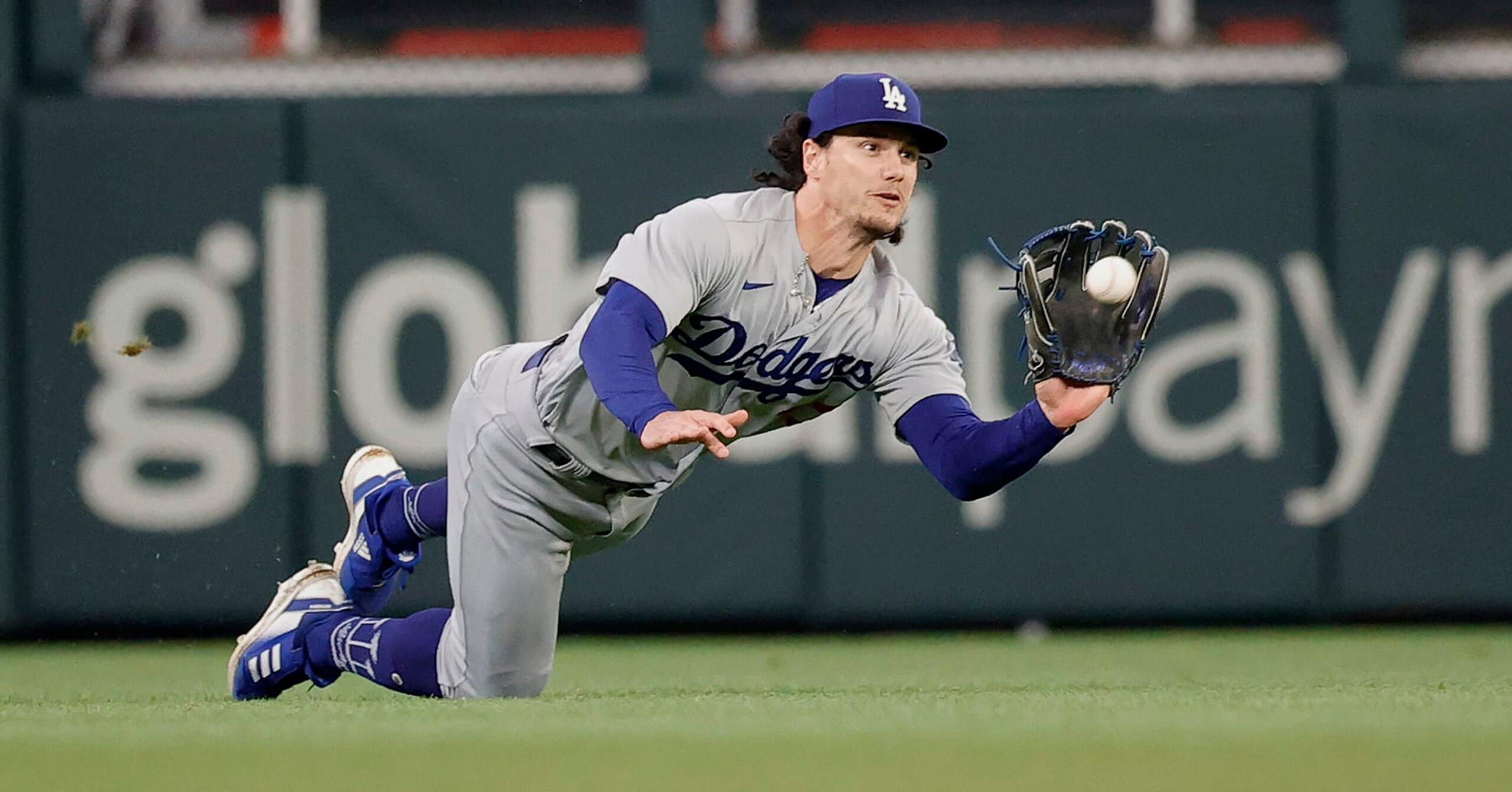 ATLANTA, GEORGIA - MAY 22: James Outman #33 of the Los Angeles Dodgers catches a fly ball hit by Eddie Rosario #8 of the Atlanta Braves in the fifth inning at Truist Park on May 22, 2023 in Atlanta, Georgia. (Photo by Alex Slitz/Getty Images)