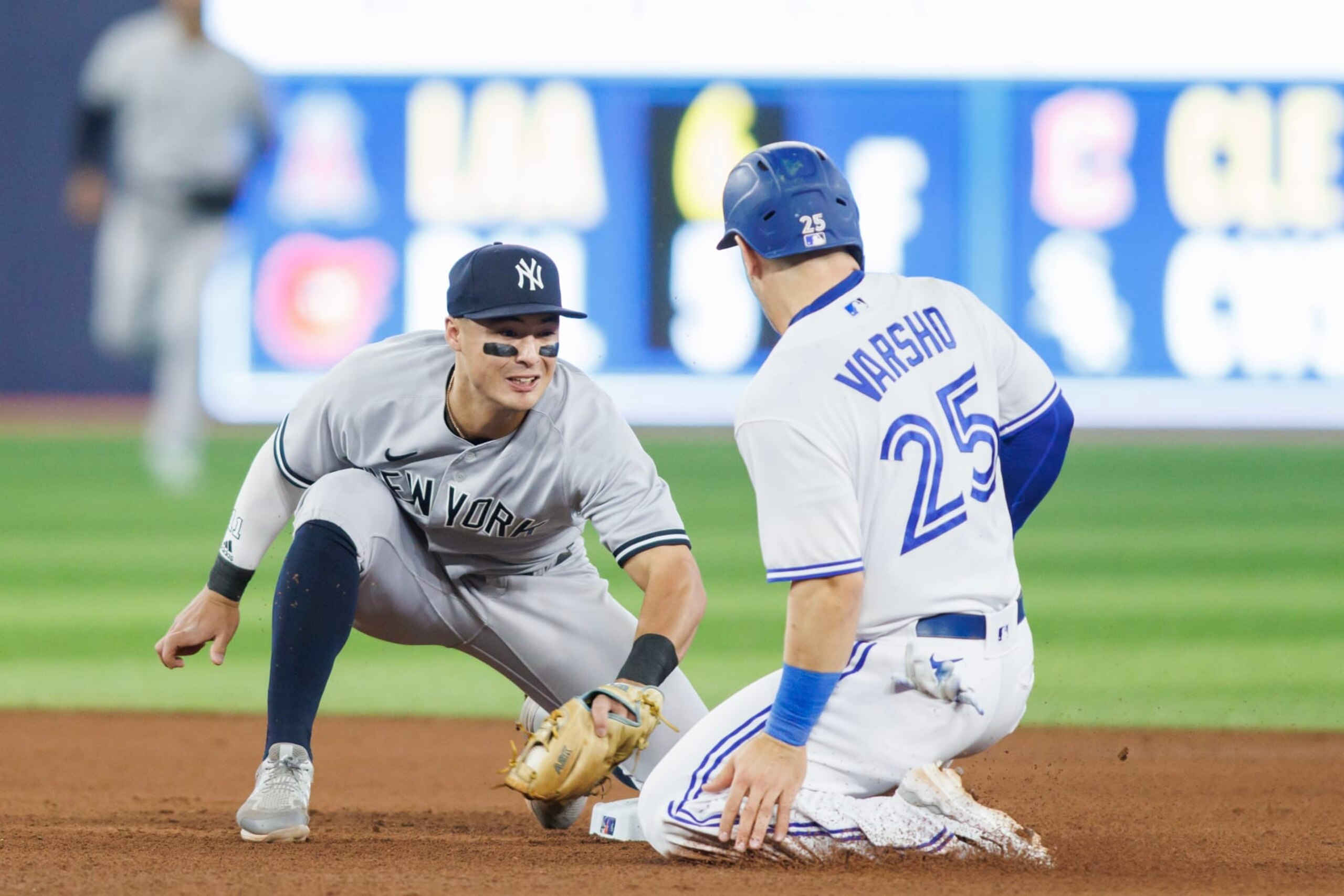 TORONTO, ON - MAY 18: Anthony Volpe #11 of the New York Yankees tags out Daulton Varsho #25 of the Toronto Blue Jays stealing second base in the fourth inning of their MLB game at Rogers Centre on May 18, 2023 in Toronto, Canada. (Photo by Cole Burston/Getty Images) TORONTO, ON - MAY 18: Anthony Volpe #11 of the New York Yankees tags out Daulton Varsho #25 of the Toronto Blue Jays stealing second base in the fourth inning of their MLB game at Rogers Centre on May 18, 2023 in Toronto, Canada. (Photo by Cole Burston/Getty Images)