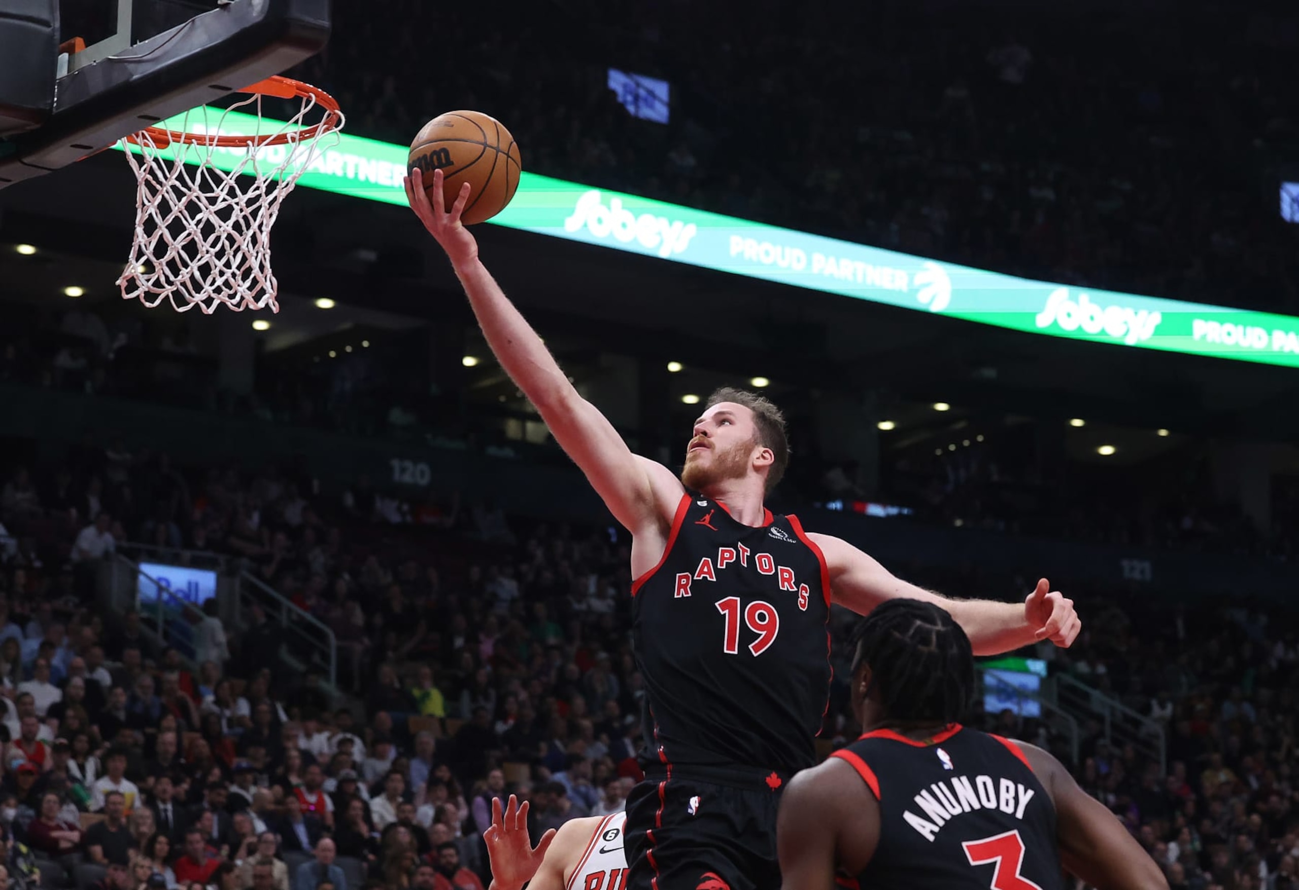 TORONTO, ON- APRIL 12  - Toronto Raptors center Jakob Poeltl (19) lays in a shot as the Toronto Raptors fall to the Chicago Bulls 109-105 in the NBA play-in game at Scotiabank Arena in Toronto. April 12, 2023.        (Steve Russell/Toronto Star via Getty Images)