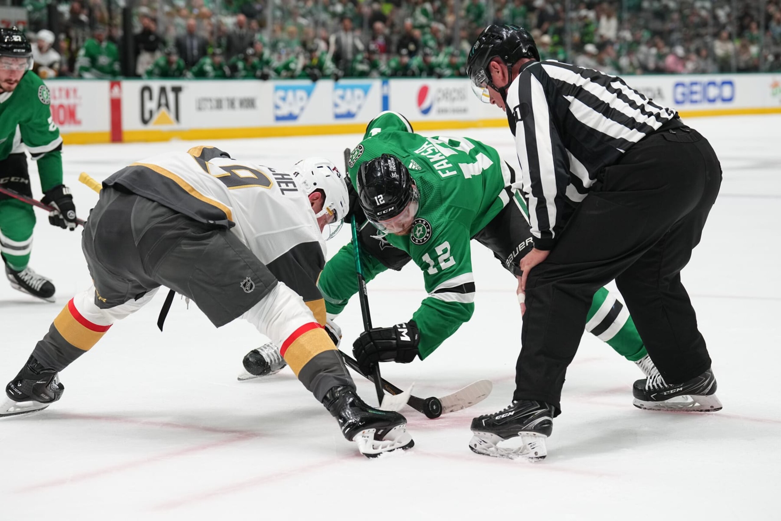 DALLAS, TX - MAY 23: Radek Faksa #12 of the Dallas Stars tries to win a face off against Jack Eichel #9 of the Vegas Golden Knights in Game Three of the Conference Final of the 2023 Stanley Cup Playoffs at the American Airlines Center on May 23, 2023 in Dallas, Texas. (Photo by Glenn James/NHLI via Getty Images)