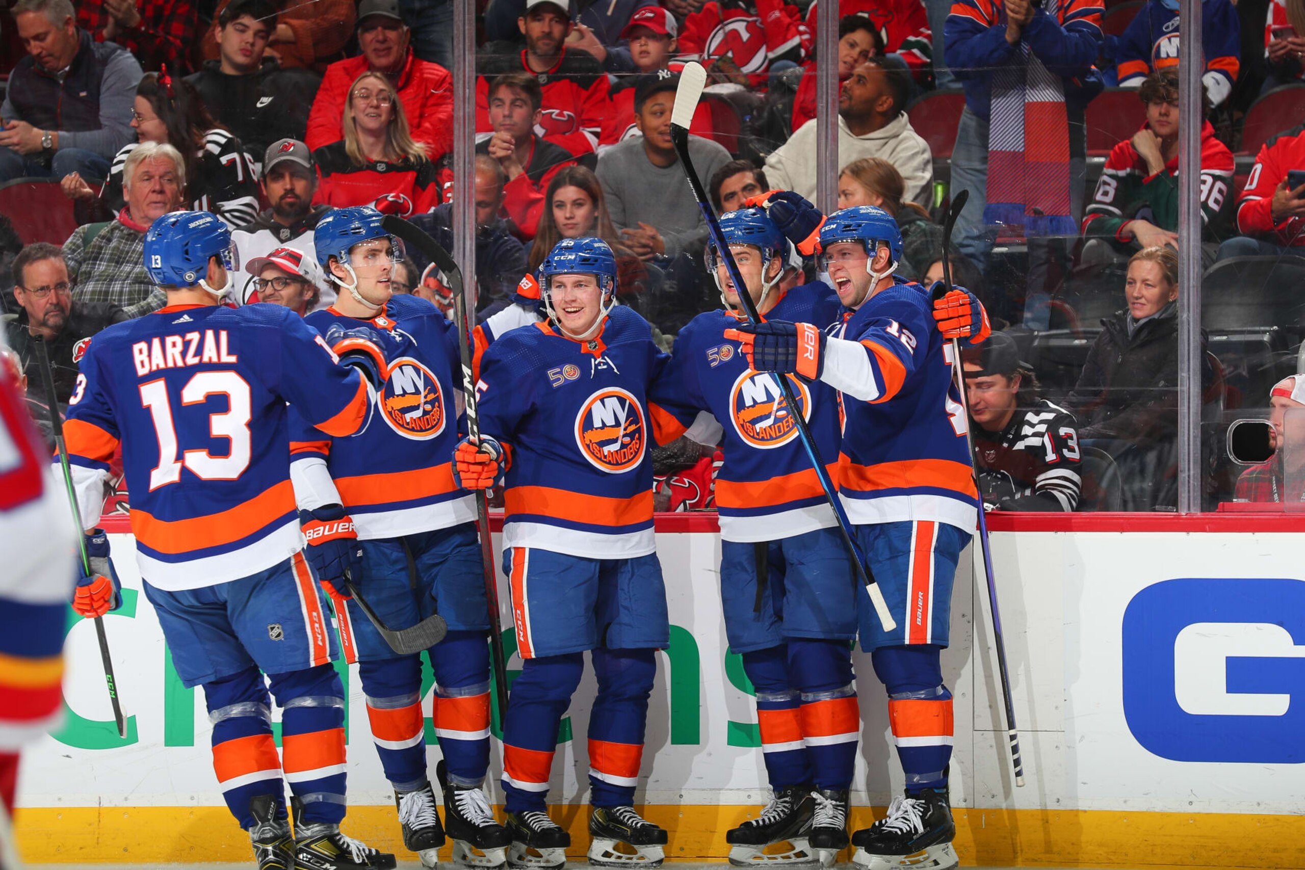 NEWARK, NJ - DECEMBER 09: Oliver Wahlstrom #26 of the New York Islanders celebrates his goal with teammates in the second period of the game against the New Jersey Devils on December 09, 2022 at the Prudential Center in Newark, New Jersey. (Photo by Rich Graessle/NHLI via Getty Images) NEWARK, NJ - DECEMBER 09: Oliver Wahlstrom #26 of the New York Islanders celebrates his goal with teammates in the second period of the game against the New Jersey Devils on December 09, 2022 at the Prudential Center in Newark, New Jersey. (Photo by Rich Graessle/NHLI via Getty Images)