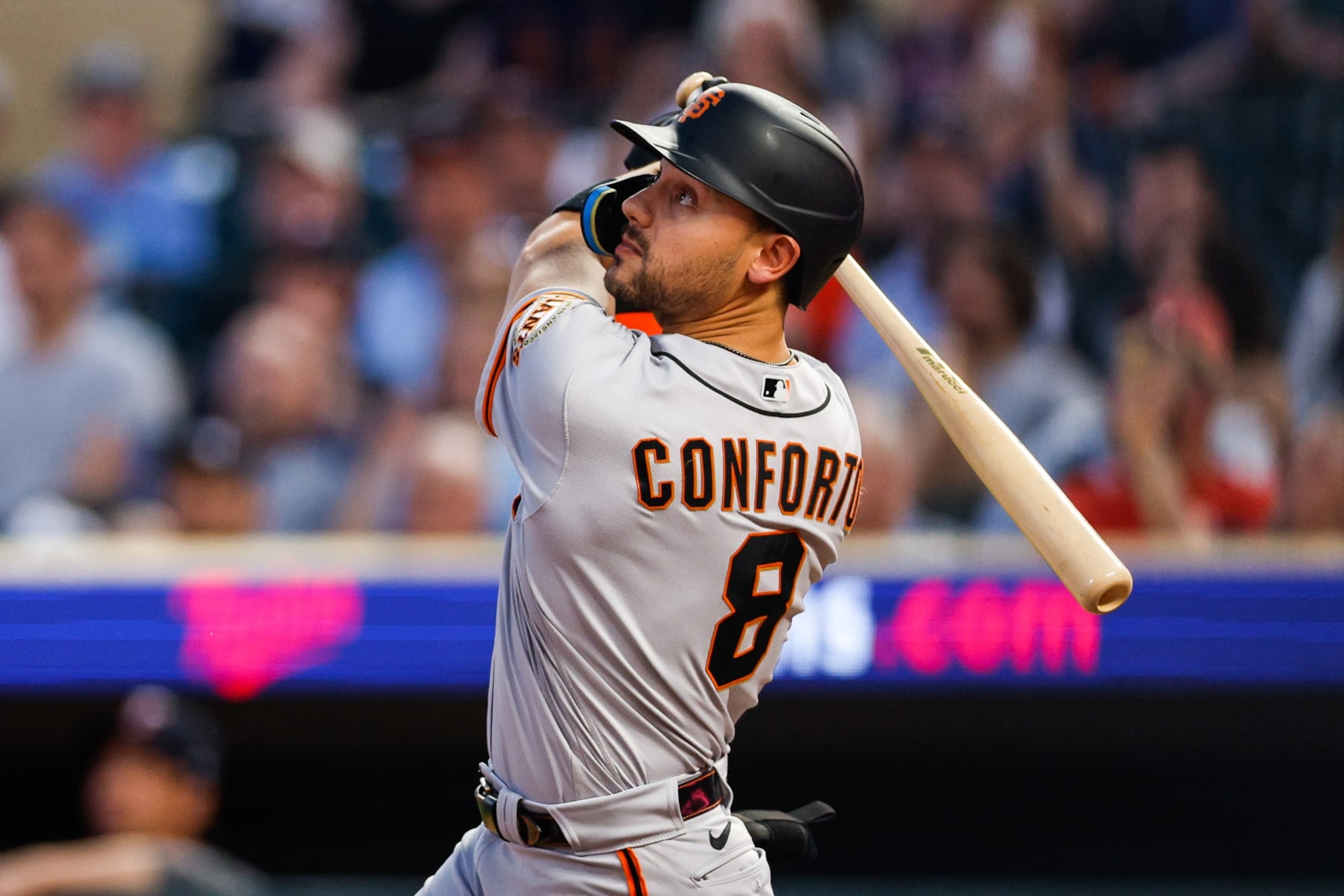 MINNEAPOLIS, MN - MAY 23: Michael Conforto #8 of the San Francisco Giants hits a two-run home run against the Minnesota Twins in the seventh inning at Target Field on May 23, 2023 in Minneapolis, Minnesota. The Giants defeated the Twins 4-3. (Photo by David Berding/Getty Images)