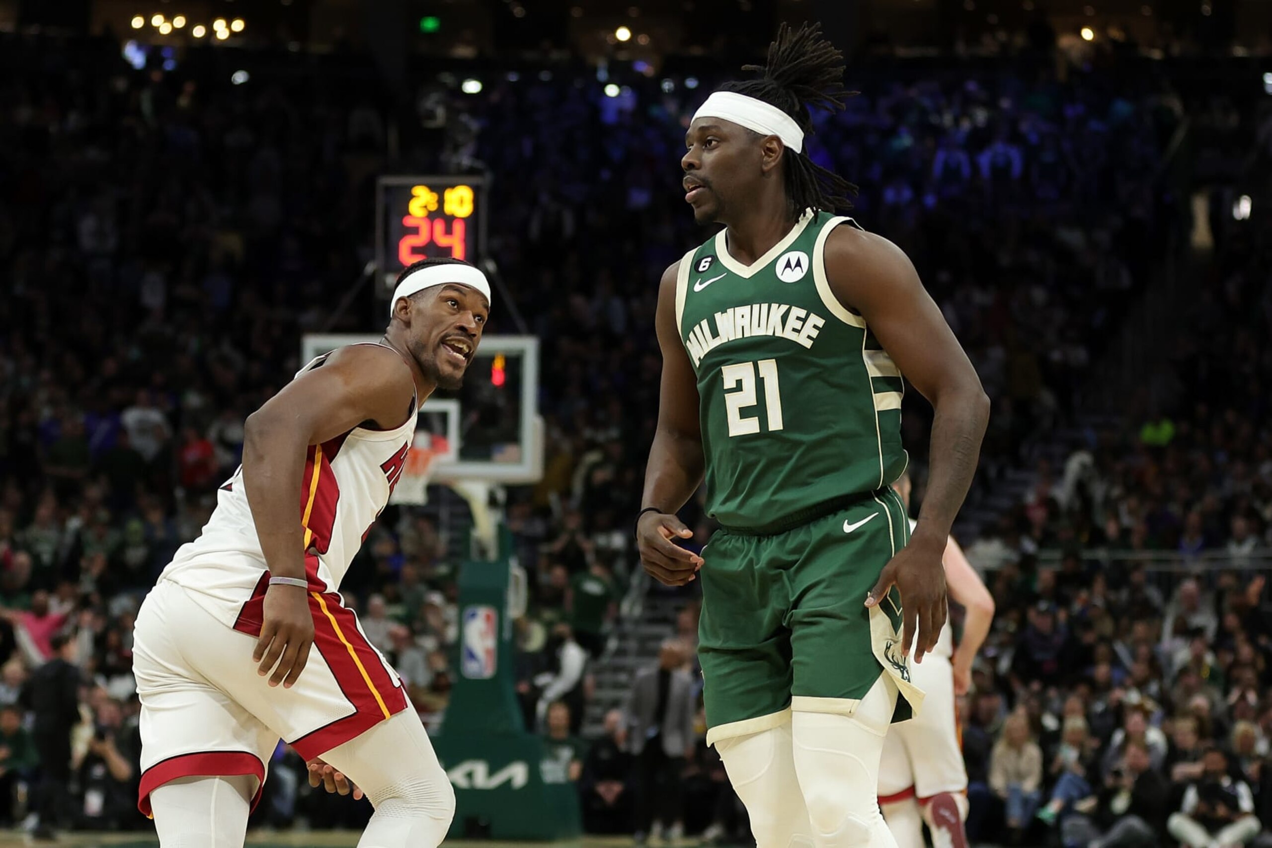 MILWAUKEE, WISCONSIN - APRIL 26: Jimmy Butler #22 of the Miami Heat and Jrue Holiday #21 of the Milwaukee Bucks exchange words during the second half of Game 5 of the Eastern Conference First Round Playoffs at Fiserv Forum on April 26, 2023 in Milwaukee, Wisconsin. NOTE TO USER: User expressly acknowledges and agrees that, by downloading and or using this photograph, User is consenting to the terms and conditions of the Getty Images License Agreement. (Photo by Stacy Revere/Getty Images)