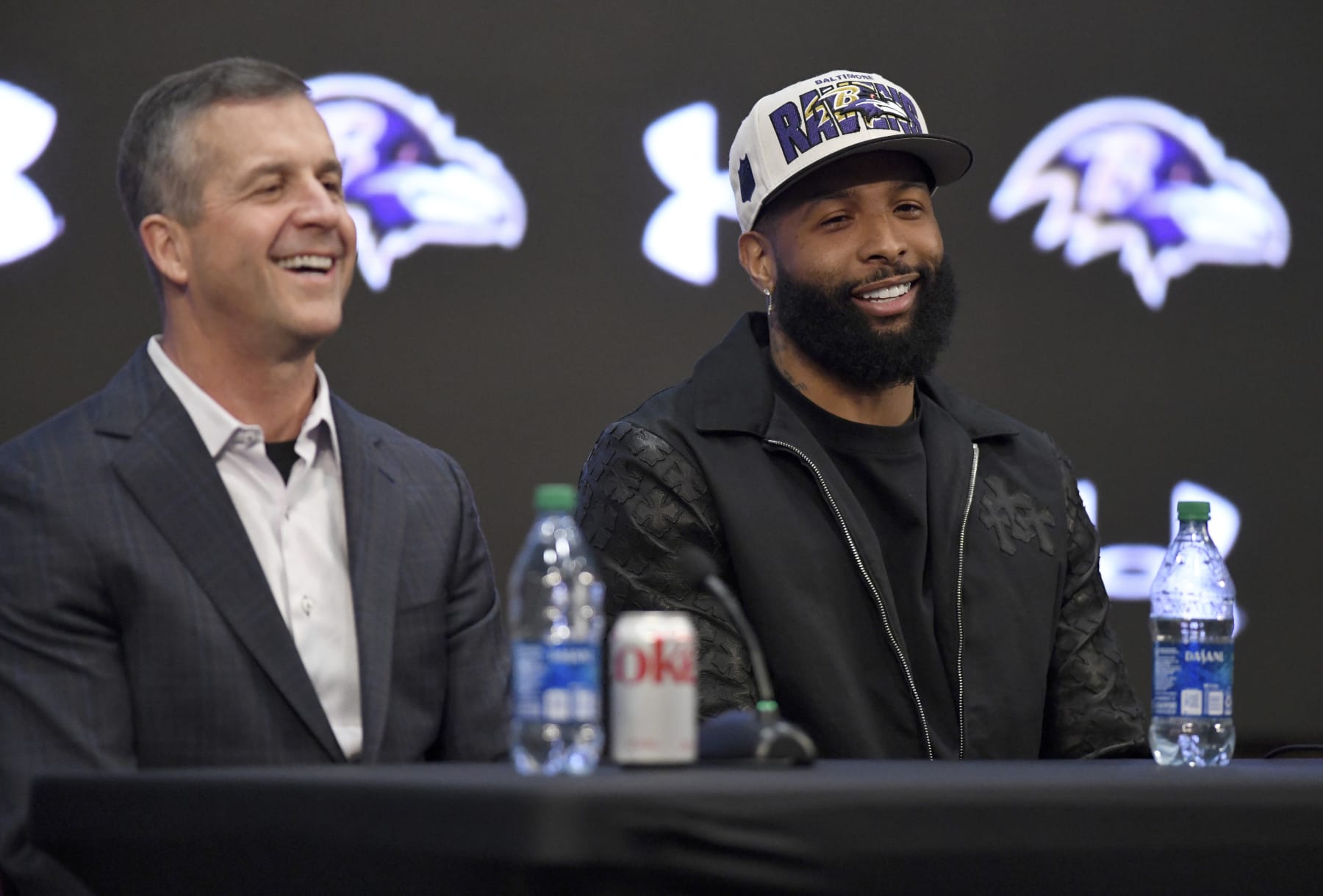 Ravens head coach John Harbaugh (left) and Odell Beckham Jr. (right)