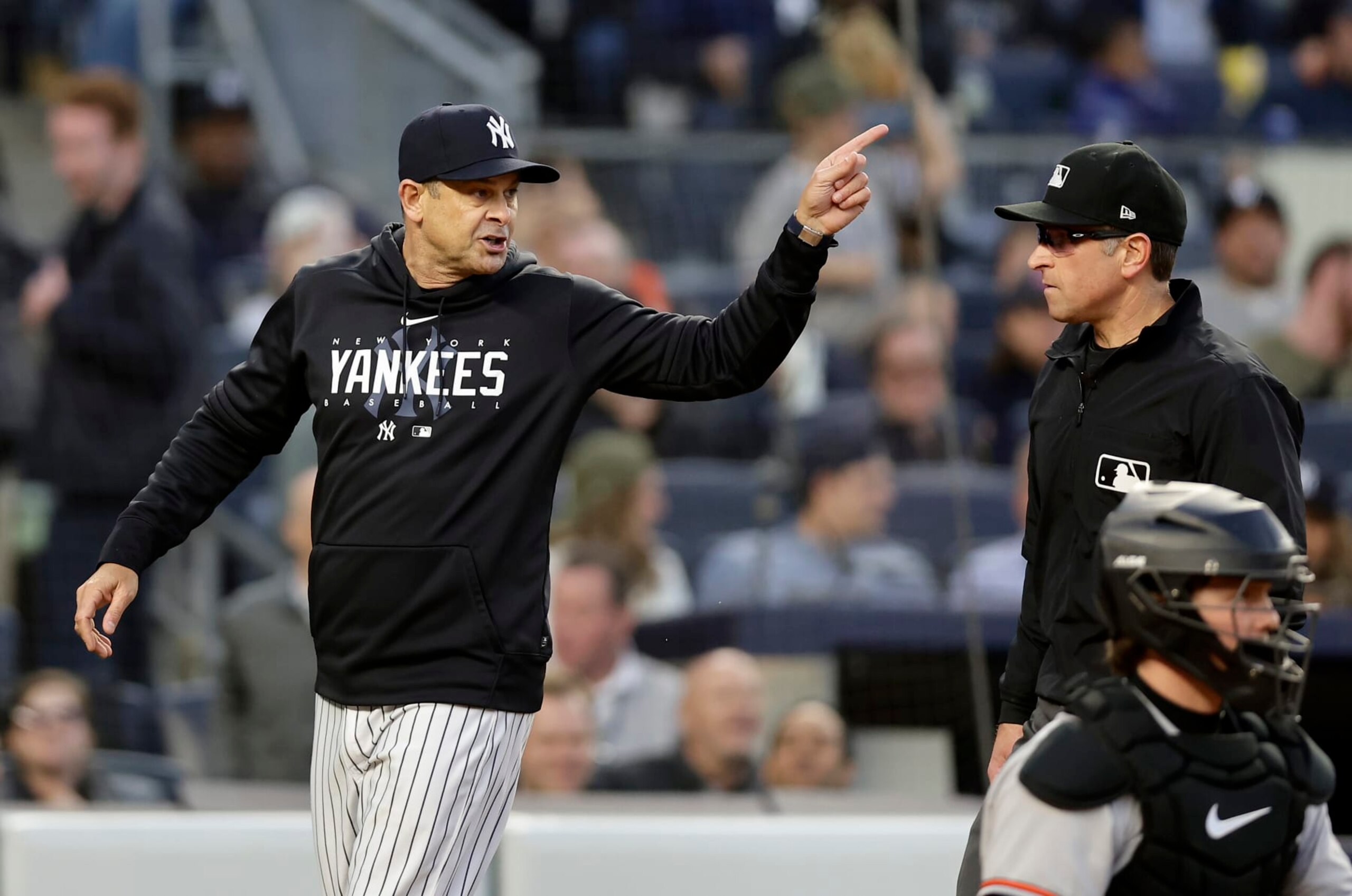 BRONX, NEW YORK - MAY 25:  Manager Aaron Boone #17 of the New York Yankees argues with first base umpire Chris Guccione after he was ejected from a game against the Baltimore Orioles in the third inning at Yankee Stadium on May 25, 2023 in Bronx, New York. (Photo by Jim McIsaac/Getty Images)