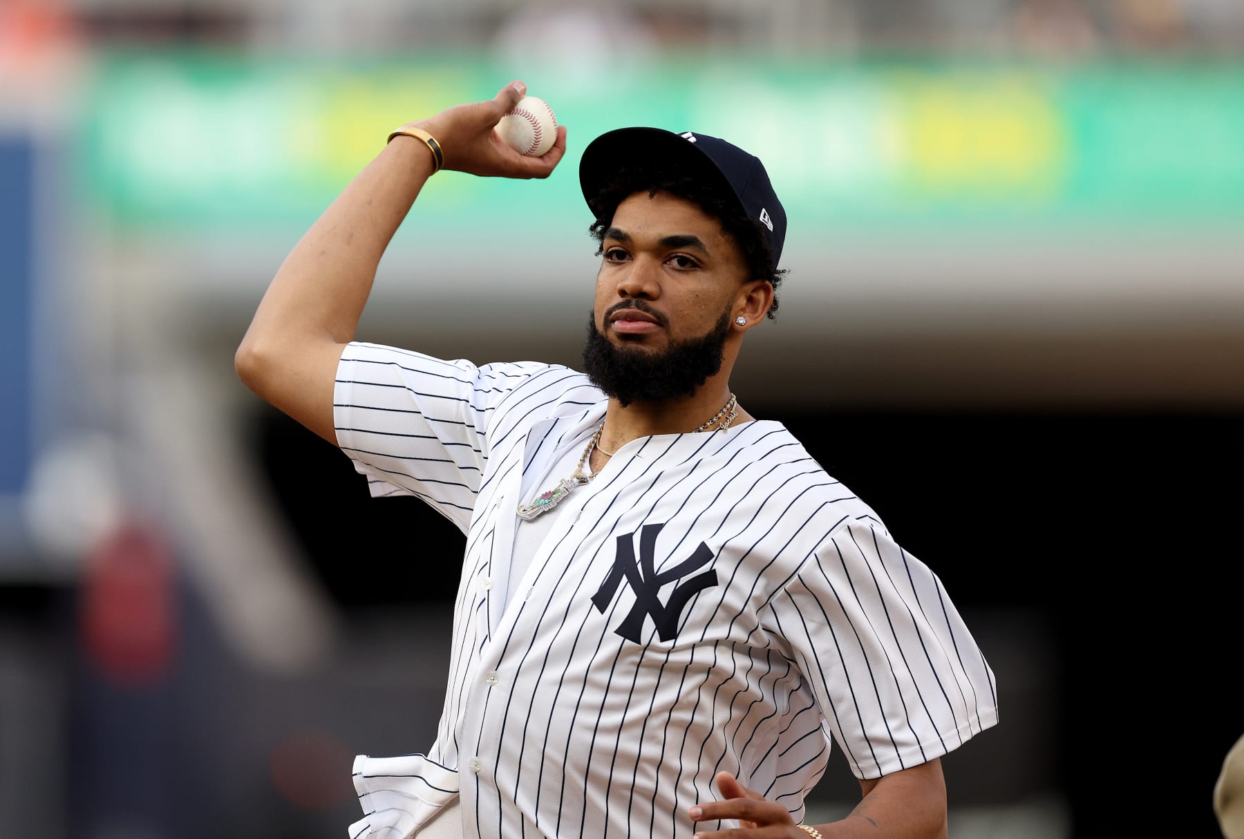 NEW YORK, NEW YORK - MAY 23:  Minnesota Timberwolves center Karl-Anthony Towns throws out the ceremonial first pitch before the game between the New York Yankees and the Baltimore Orioles at Yankee Stadium on May 23, 2023 in Bronx borough of New York City. (Photo by Elsa/Getty Images)