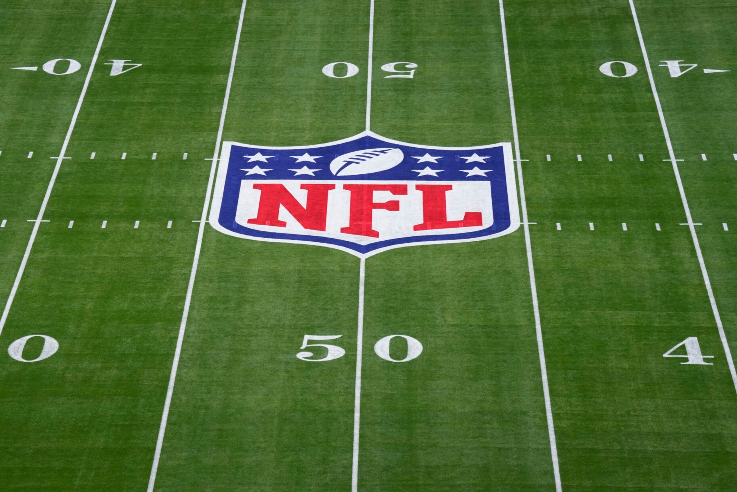 GLENDALE, AZ - FEBRUARY 12: Elevated view of the NFL Shield logo painted on the field prior to Super Bowl LVII between the Kansas City Chiefs and the Philadelphia Eagles at State Farm Stadium on February 12, 2023 in Glendale, Arizona. (Photo by Cooper Neill/Getty Images)