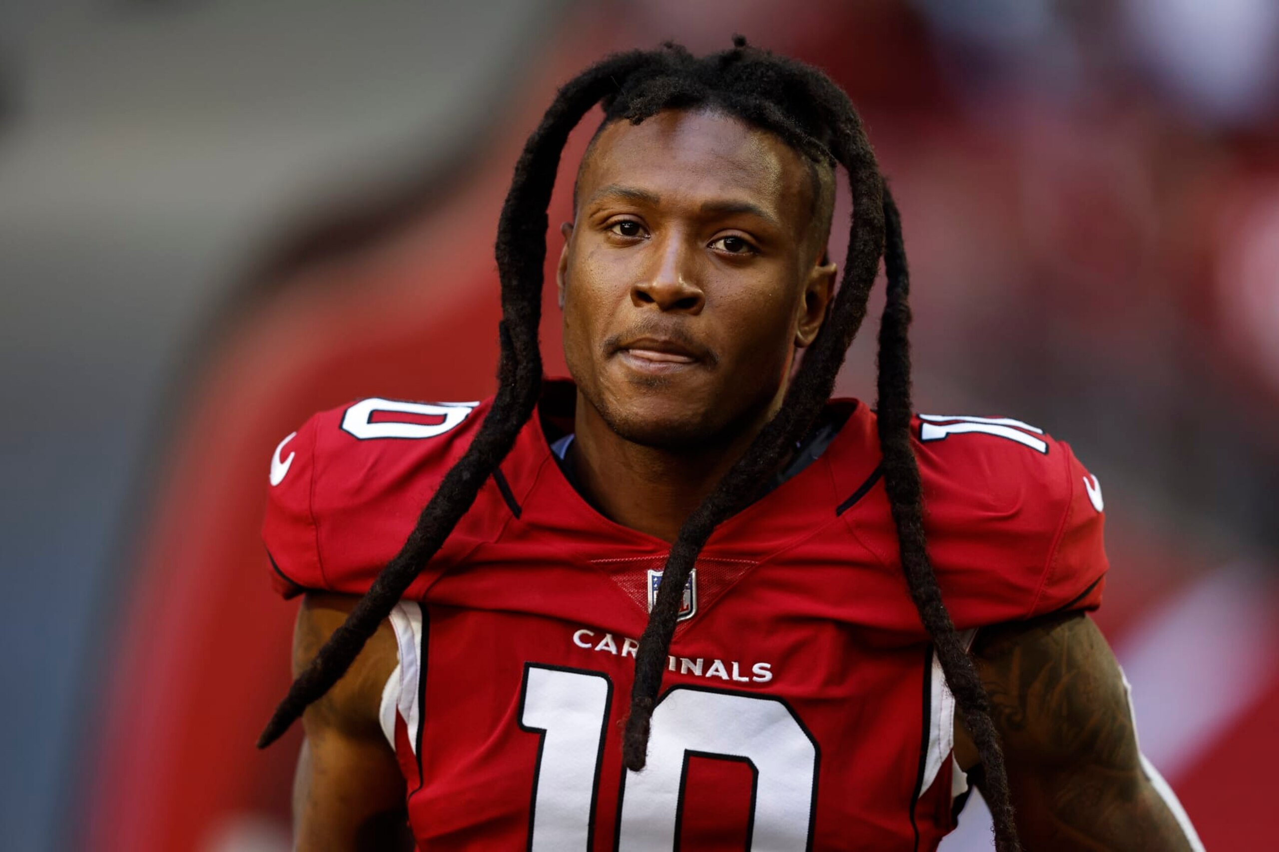 GLENDALE, ARIZONA - NOVEMBER 06: DeAndre Hopkins #10 of the Arizona Cardinals looks on as he takes the field prior to an NFL Football game between the Arizona Cardinals and the Seattle Seahawks at State Farm Stadium on November 06, 2022 in Glendale, Arizona. (Photo by Michael Owens/Getty Images)